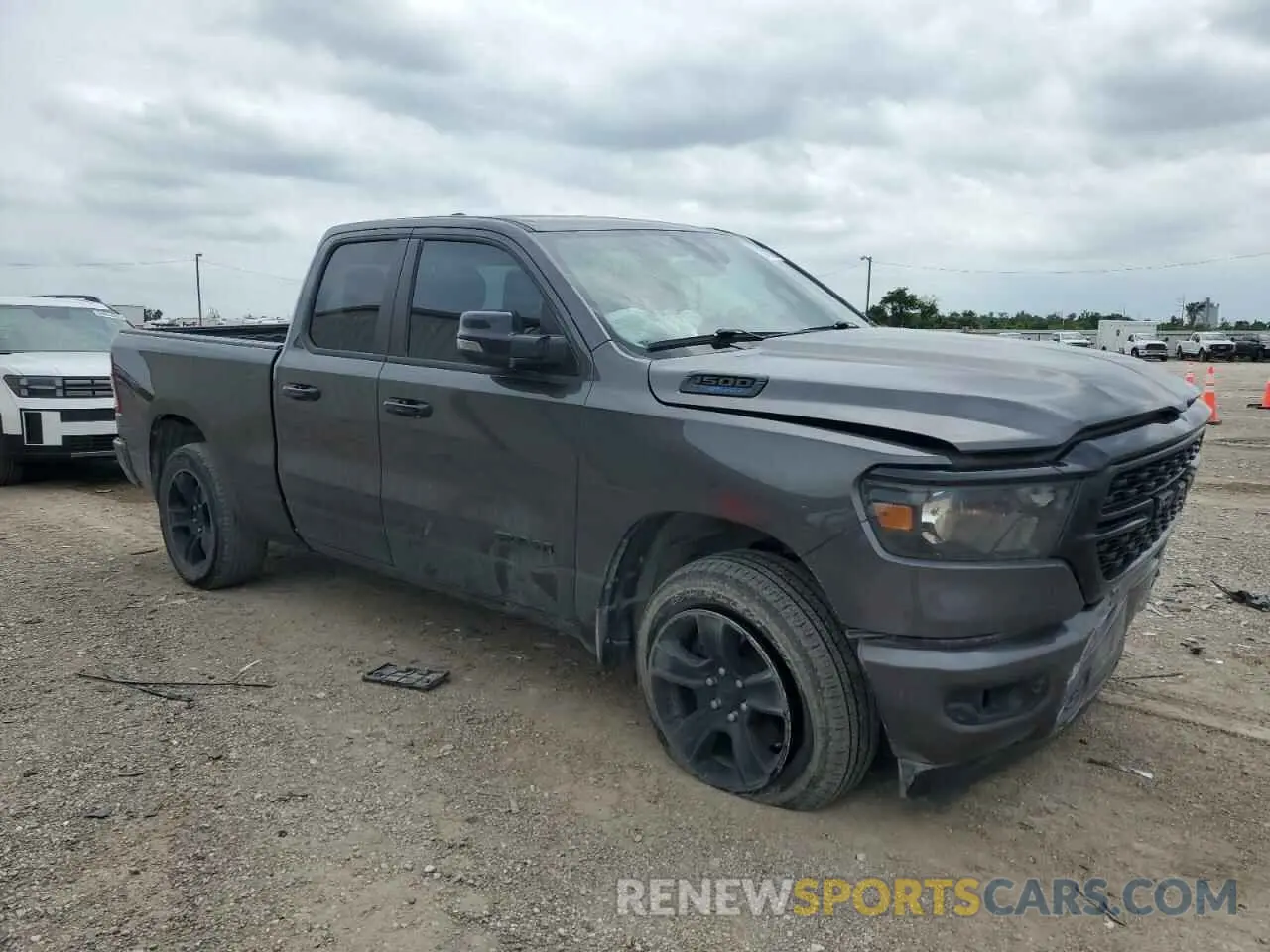 4 Photograph of a damaged car 1C6SRFBT4PN557989 RAM 1500 2023