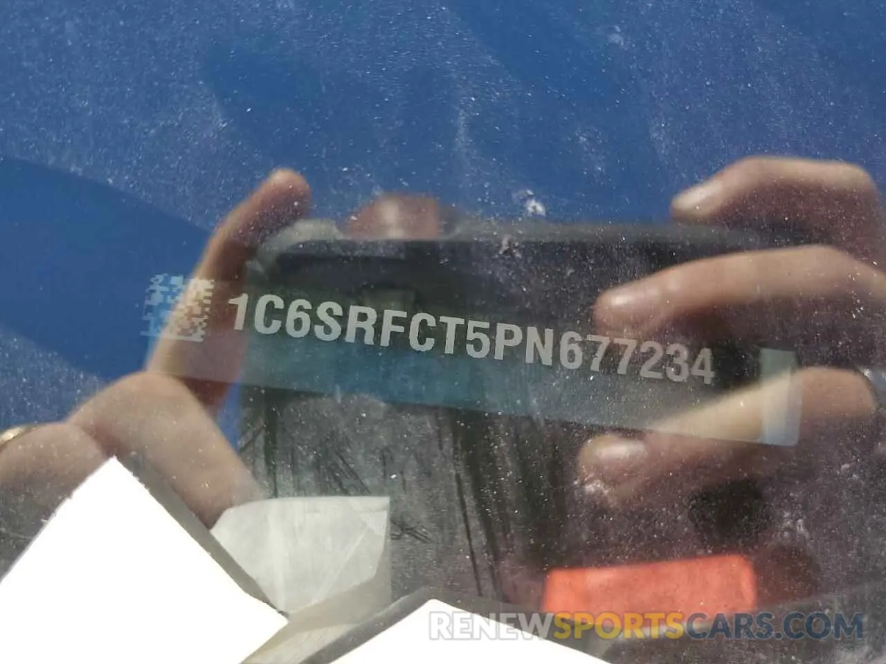 12 Photograph of a damaged car 1C6SRFCT5PN677234 RAM 1500 2023