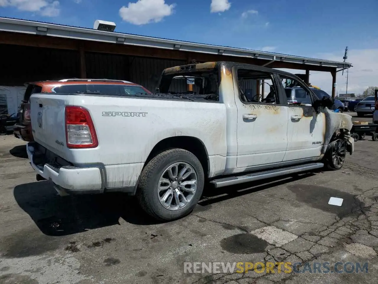 3 Photograph of a damaged car 1C6SRFFM0PN552050 RAM 1500 2023