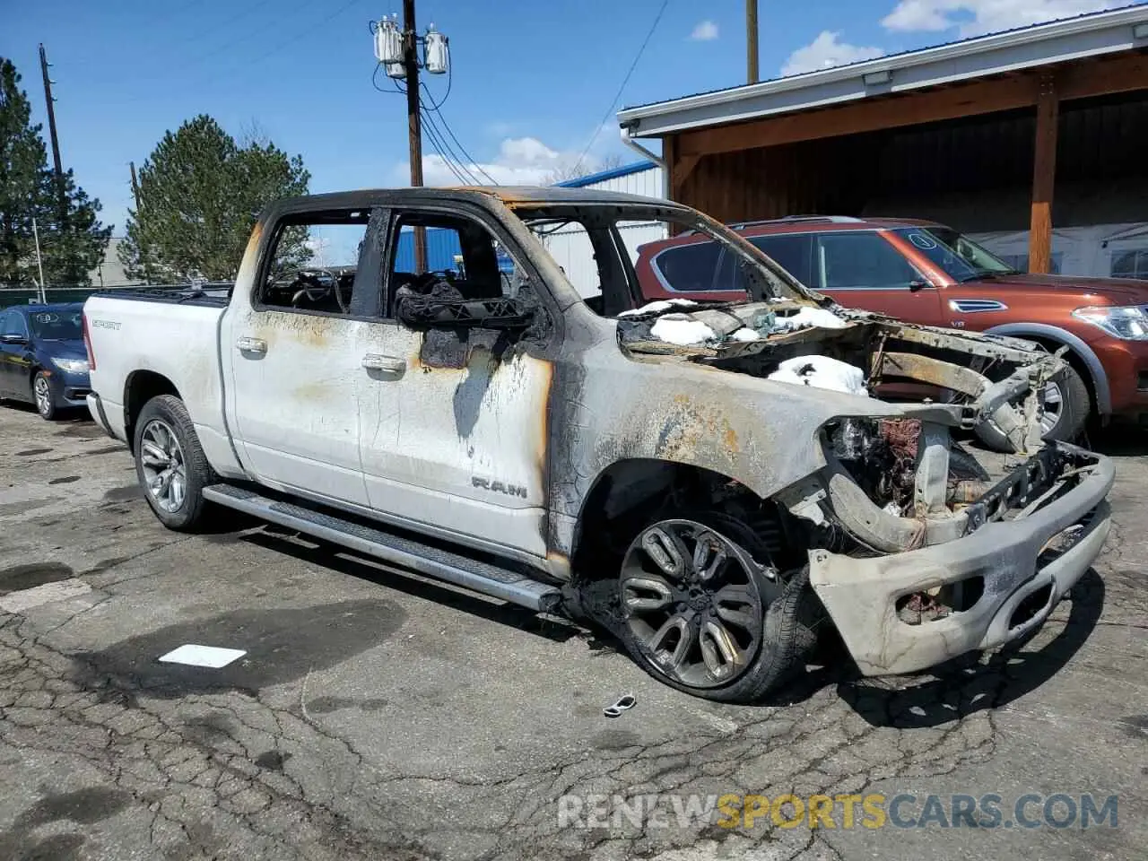 4 Photograph of a damaged car 1C6SRFFM0PN552050 RAM 1500 2023