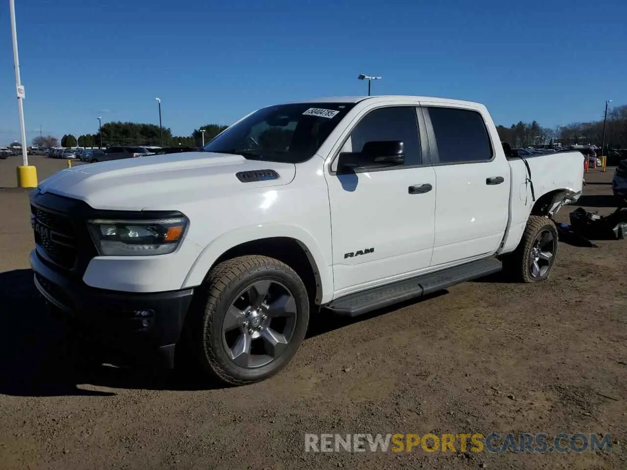 1 Photograph of a damaged car 1C6SRFFT0PN546773 RAM 1500 2023