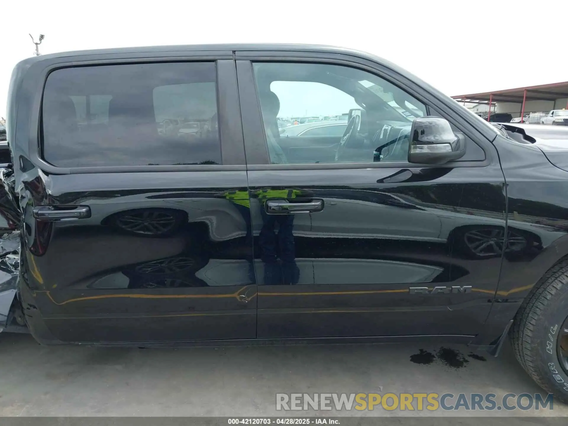14 Photograph of a damaged car 1C6SRFFT0PN548524 RAM 1500 2023