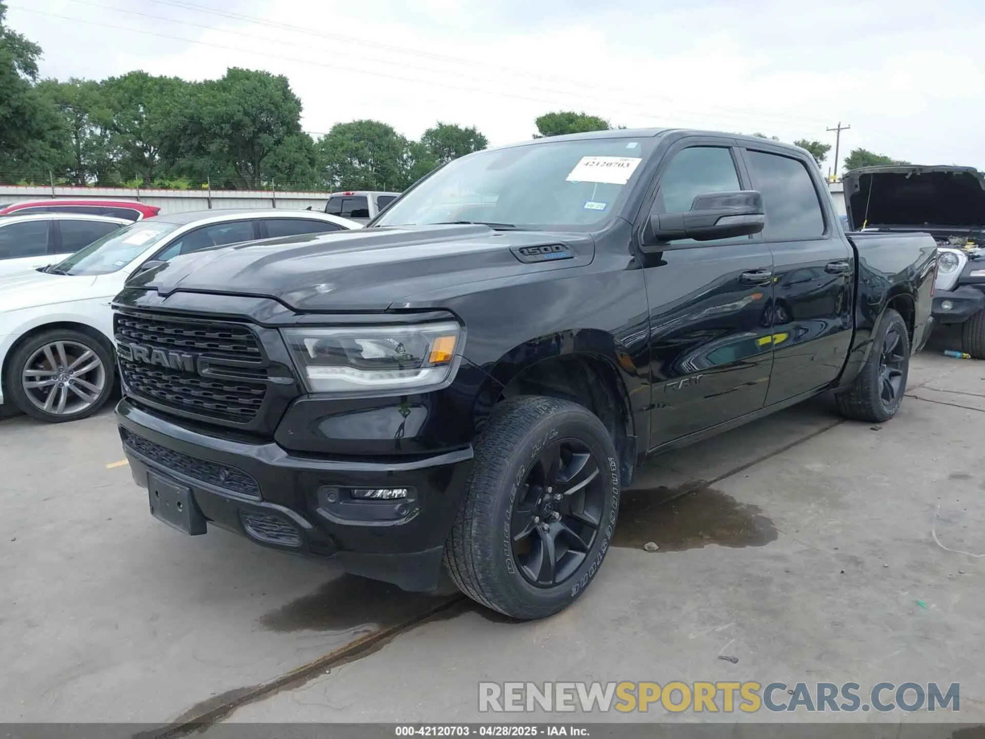 2 Photograph of a damaged car 1C6SRFFT0PN548524 RAM 1500 2023
