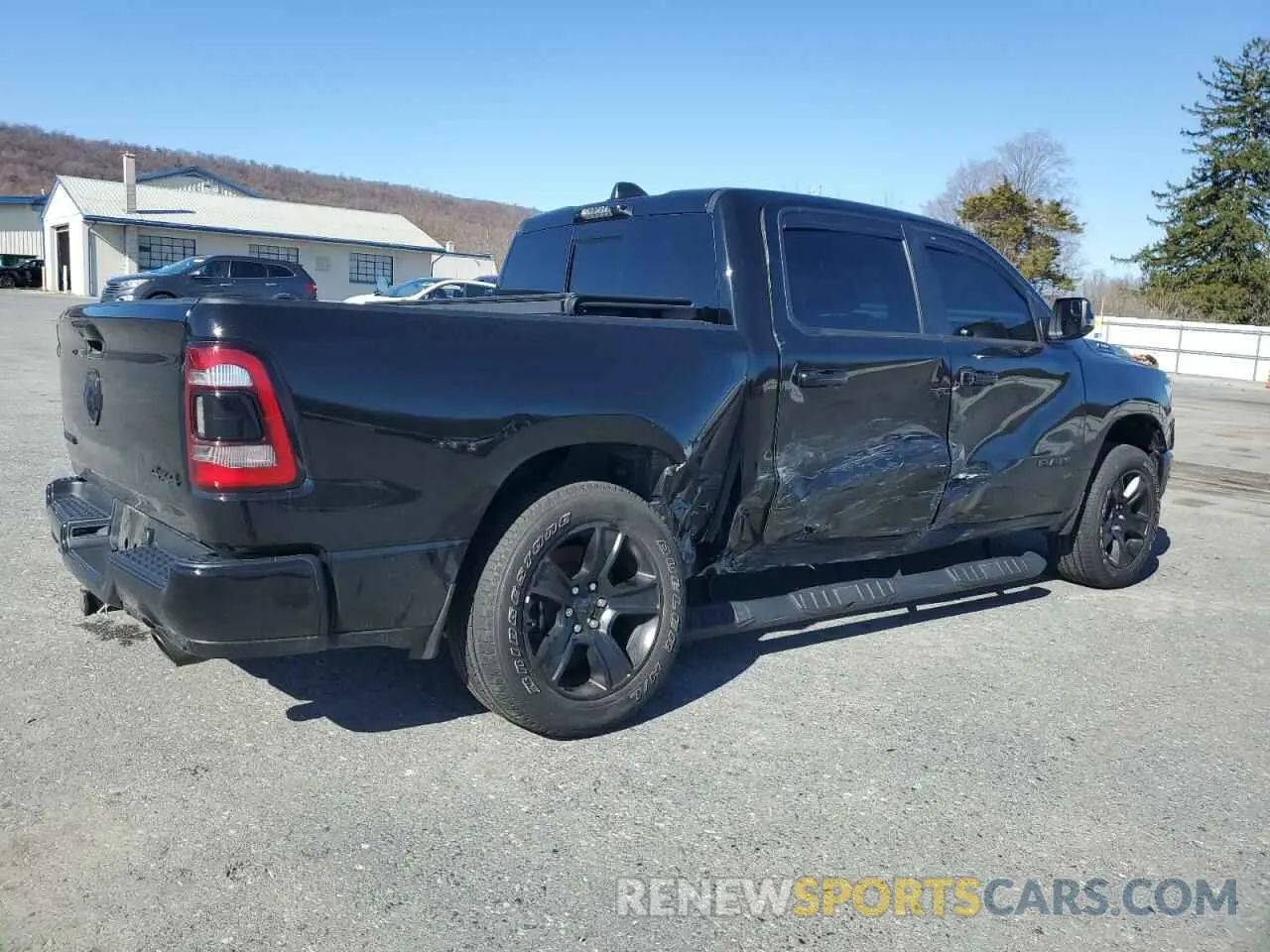 3 Photograph of a damaged car 1C6SRFFT0PN613131 RAM 1500 2023