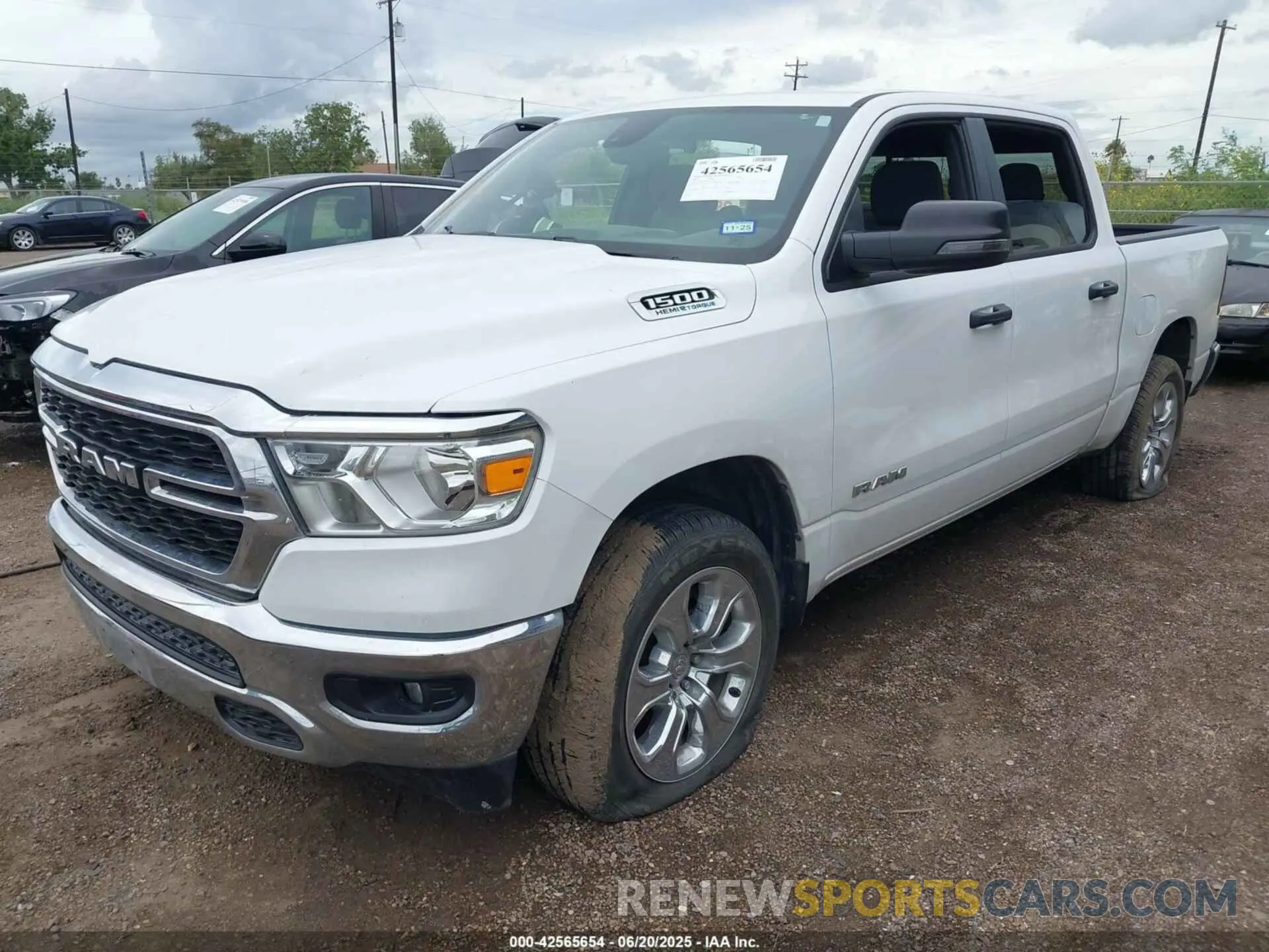 2 Photograph of a damaged car 1C6SRFFT0PN702987 RAM 1500 2023