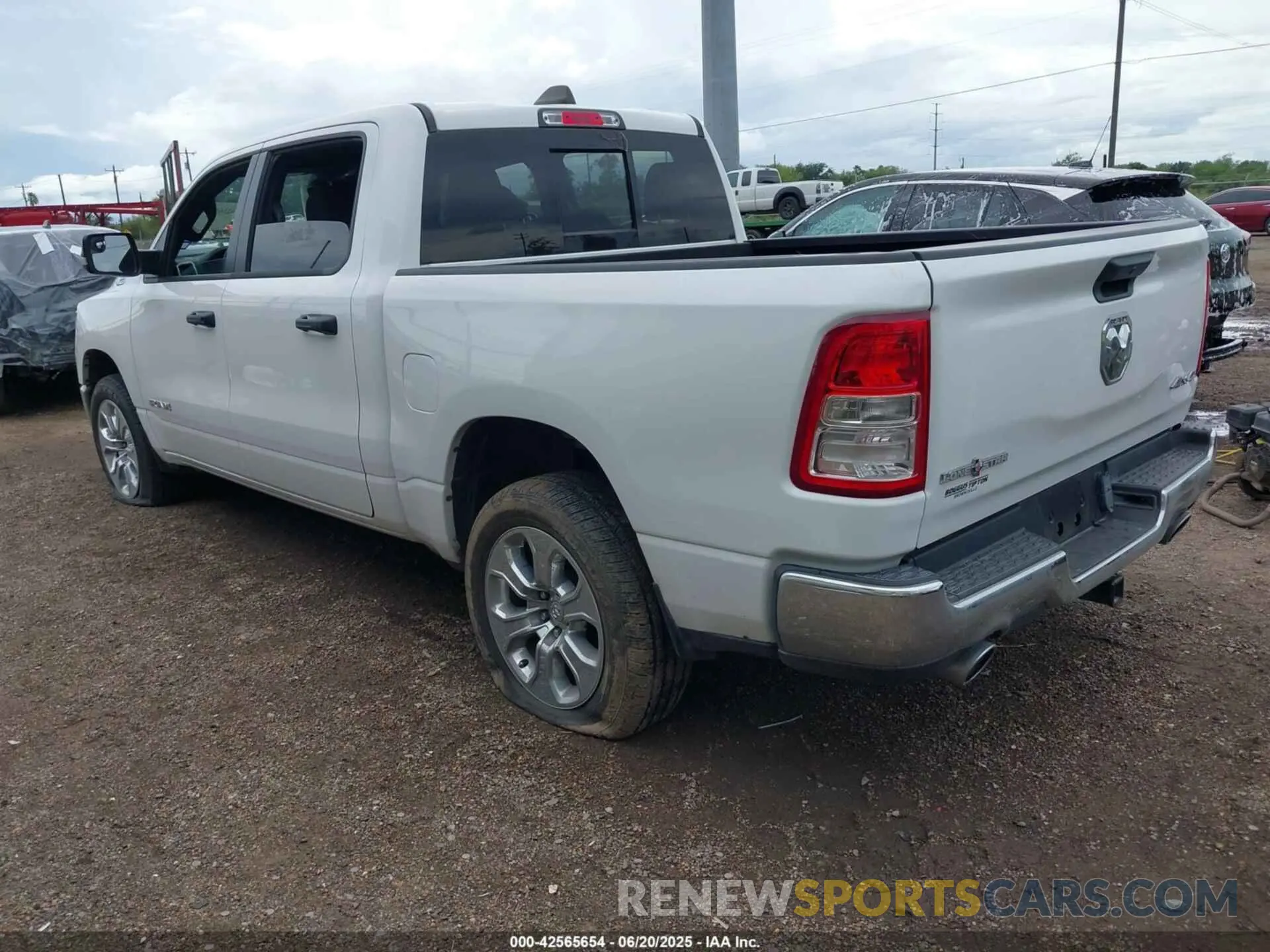 3 Photograph of a damaged car 1C6SRFFT0PN702987 RAM 1500 2023