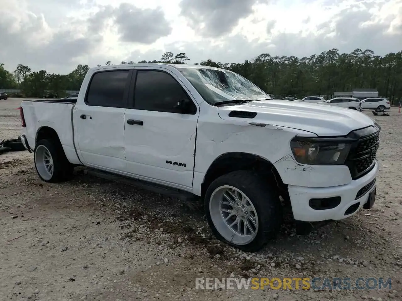 4 Photograph of a damaged car 1C6SRFFT1PN605393 RAM 1500 2023