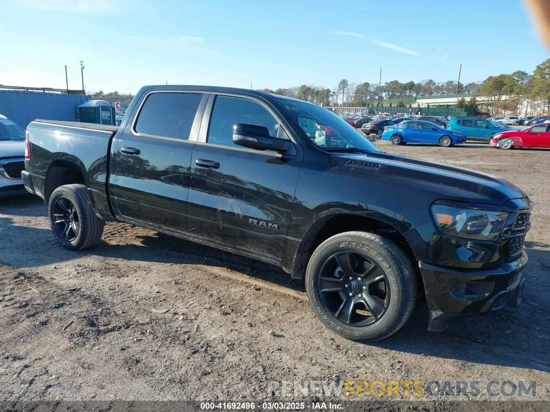 1 Photograph of a damaged car 1C6SRFFT1PN660751 RAM 1500 2023