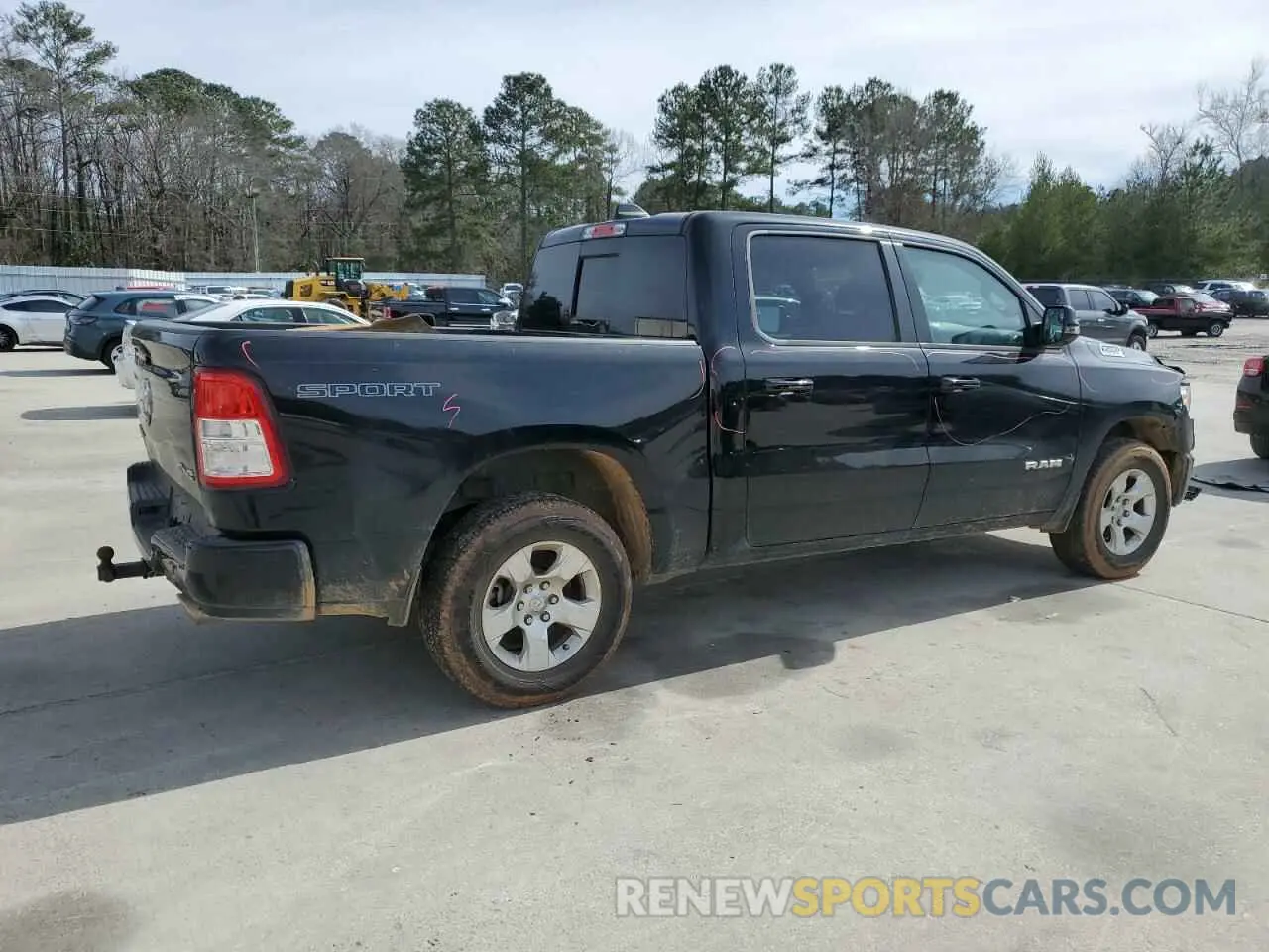 3 Photograph of a damaged car 1C6SRFFT2PN704790 RAM 1500 2023