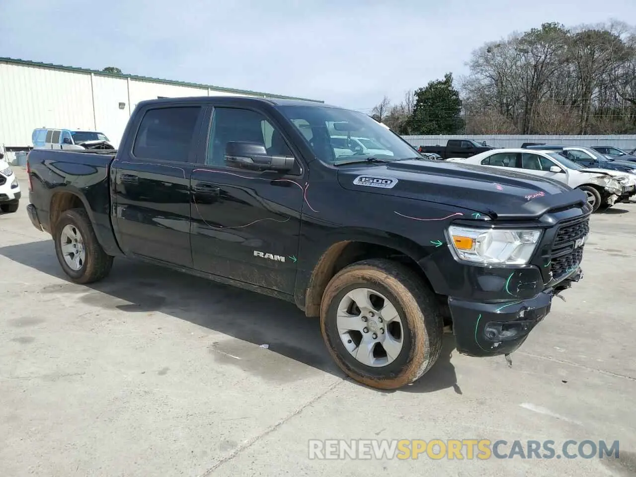 4 Photograph of a damaged car 1C6SRFFT2PN704790 RAM 1500 2023