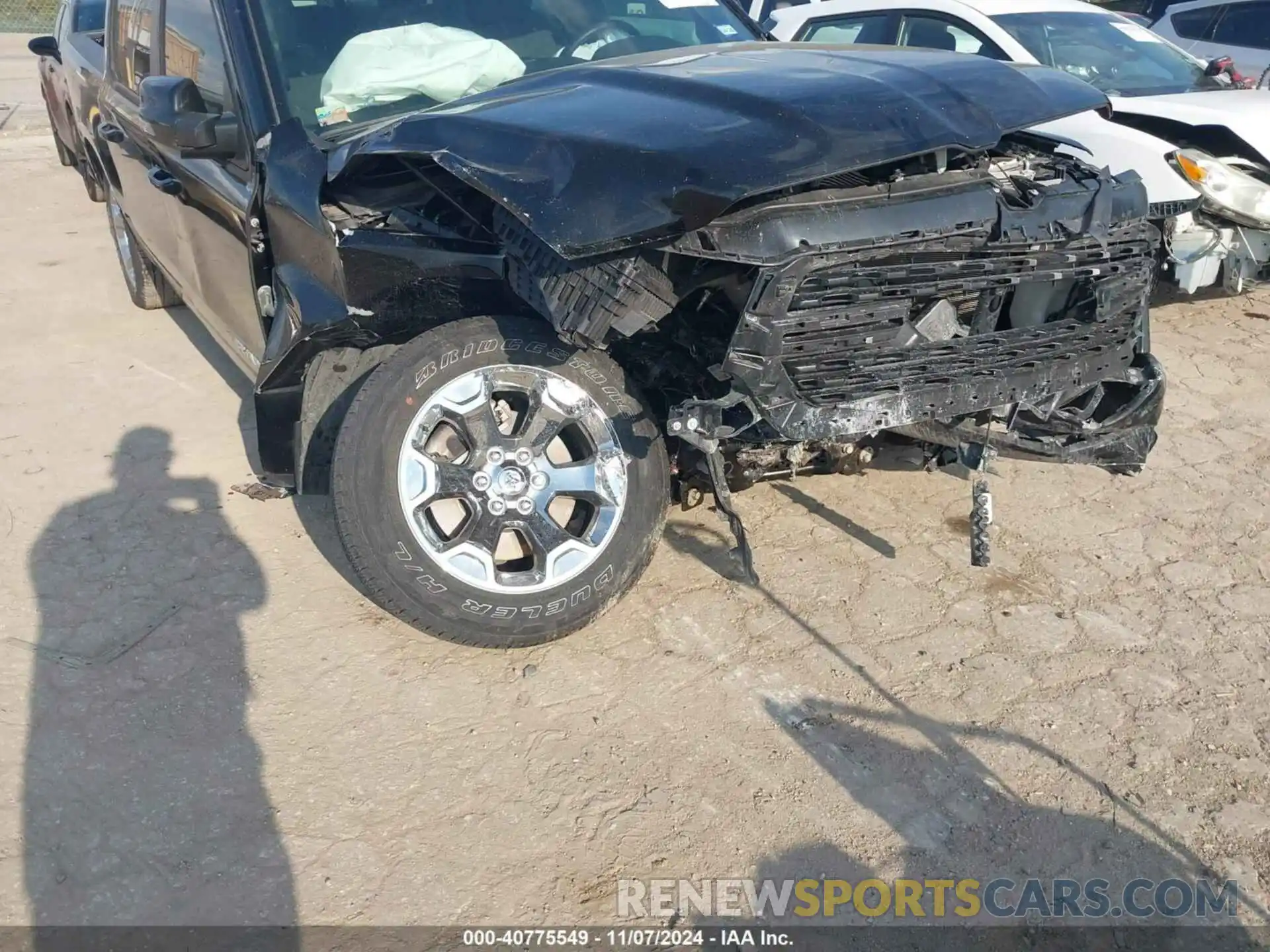 6 Photograph of a damaged car 1C6SRFFT3PN702899 RAM 1500 2023