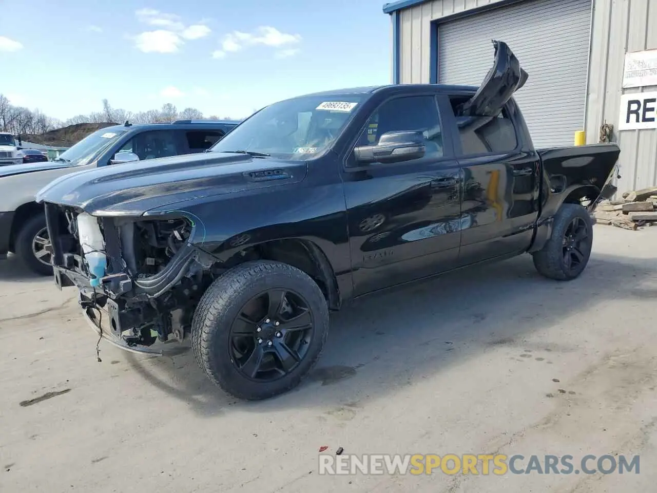1 Photograph of a damaged car 1C6SRFFT4PN678323 RAM 1500 2023