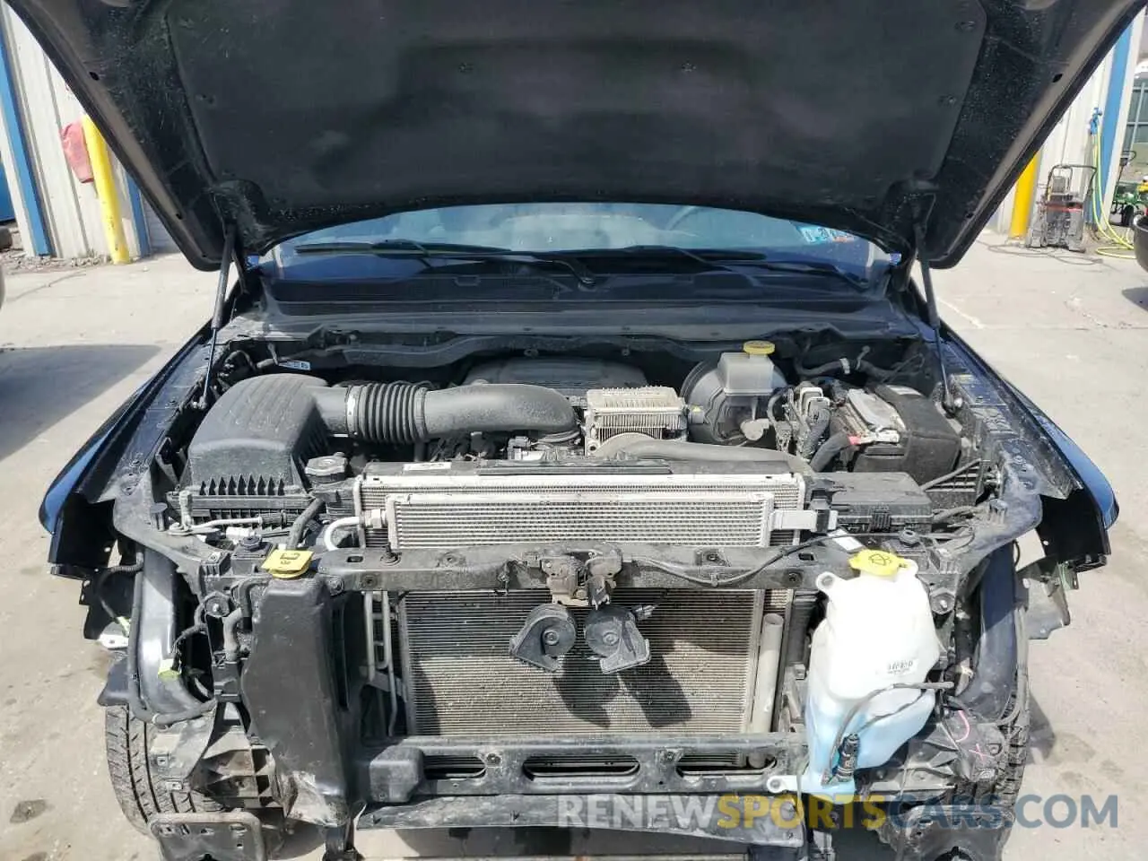 11 Photograph of a damaged car 1C6SRFFT4PN678323 RAM 1500 2023