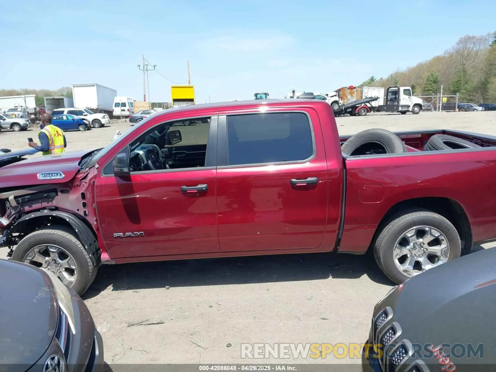 14 Photograph of a damaged car 1C6SRFFT4PN688110 RAM 1500 2023