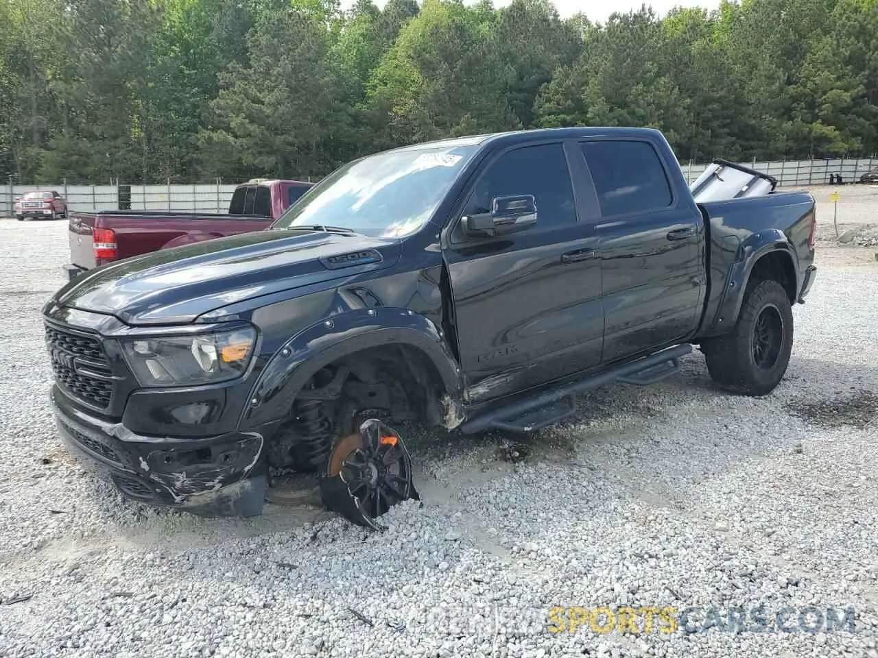 1 Photograph of a damaged car 1C6SRFFT6PN677982 RAM 1500 2023