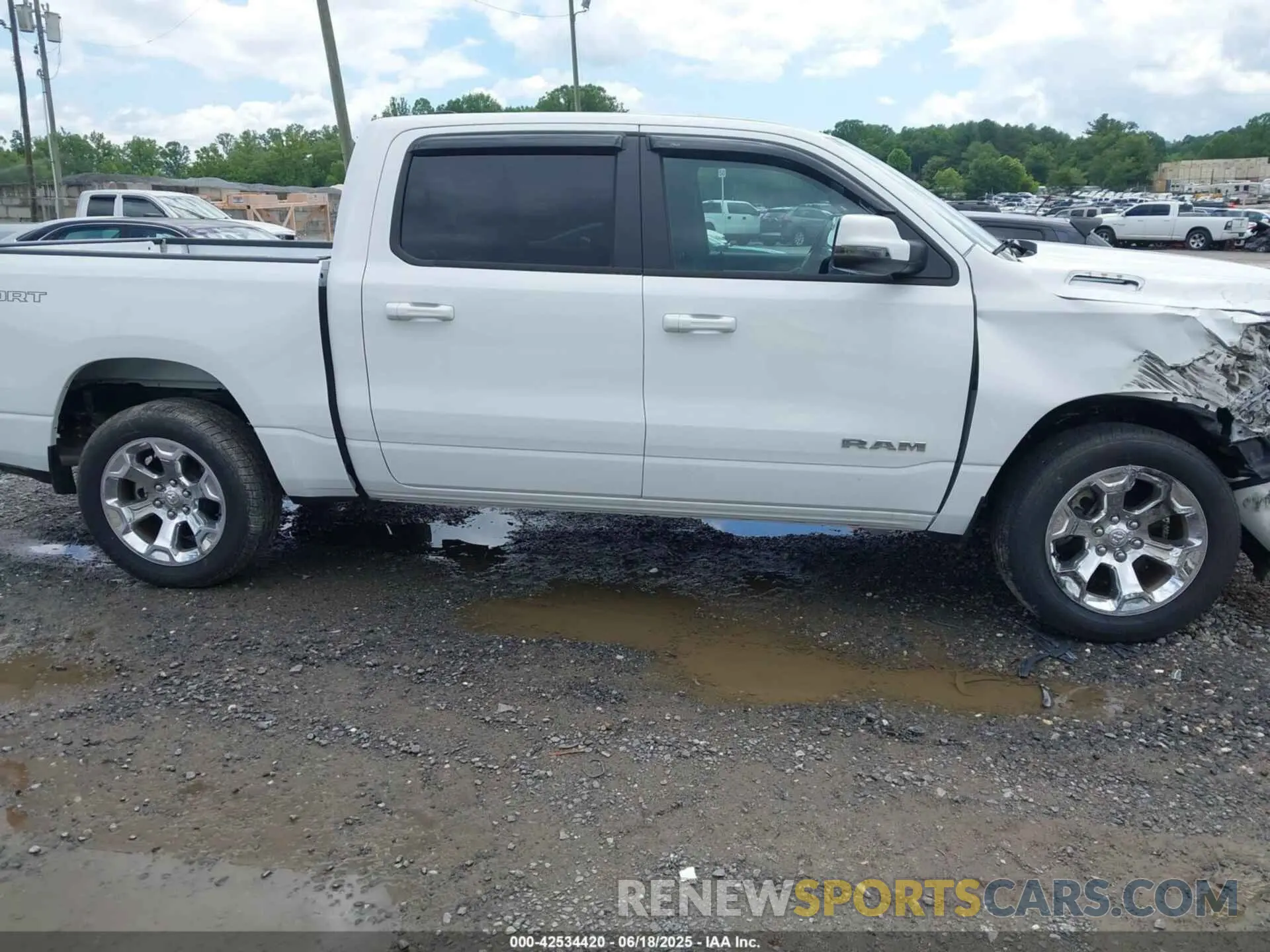 13 Photograph of a damaged car 1C6SRFFT7PN704929 RAM 1500 2023