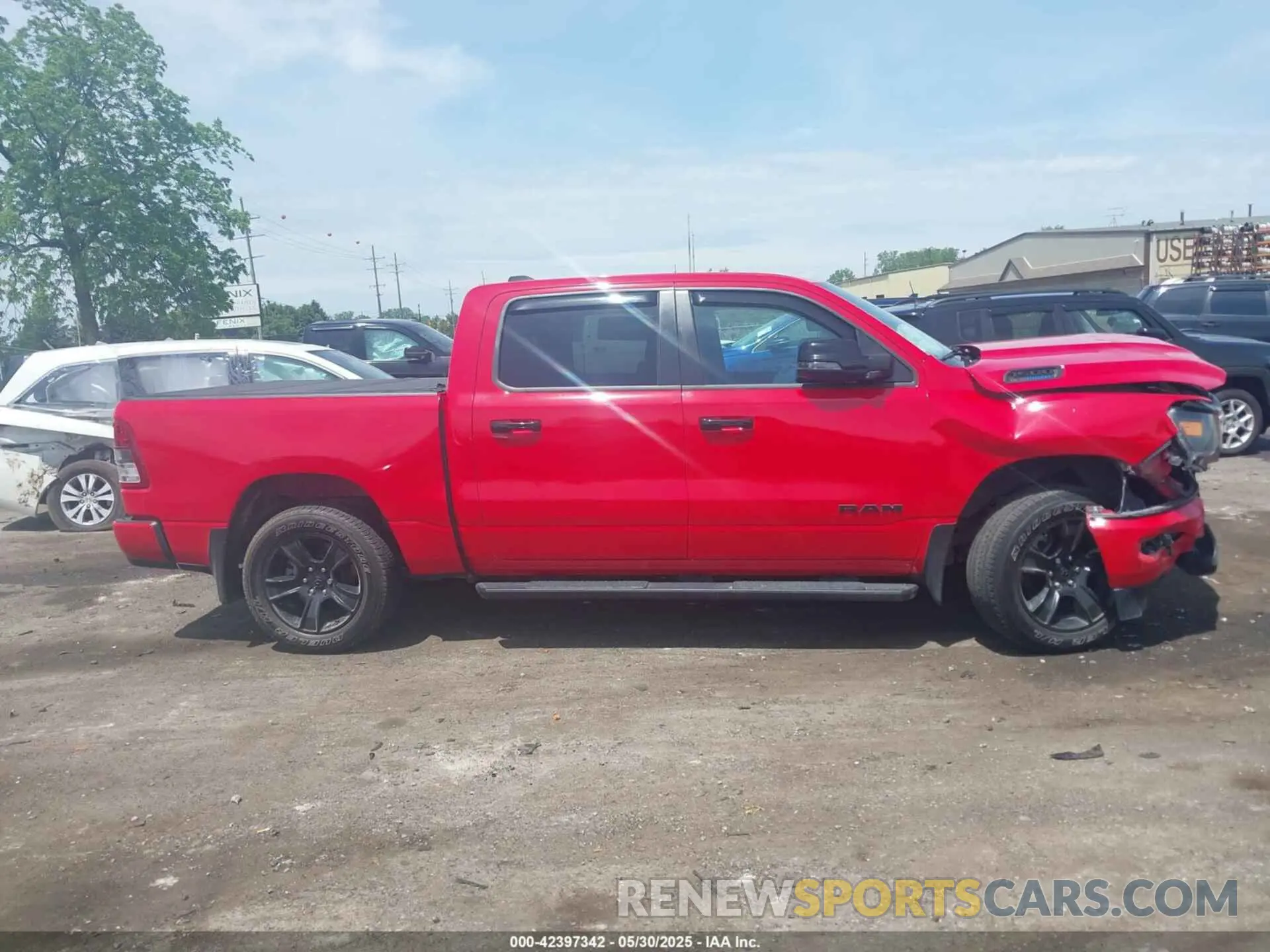 13 Photograph of a damaged car 1C6SRFFT9PN509690 RAM 1500 2023