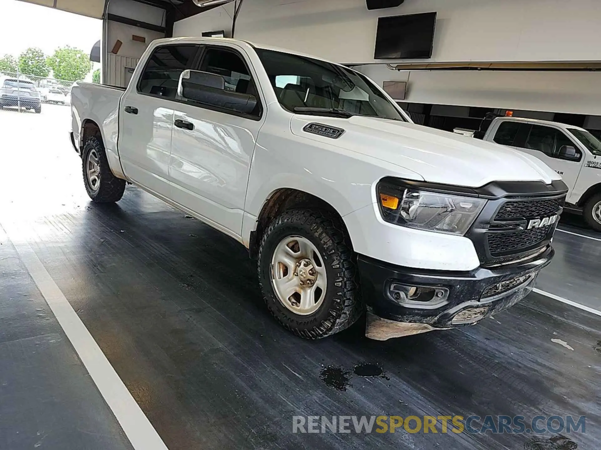 14 Photograph of a damaged car 1C6SRFGT2PN560947 RAM 1500 2023
