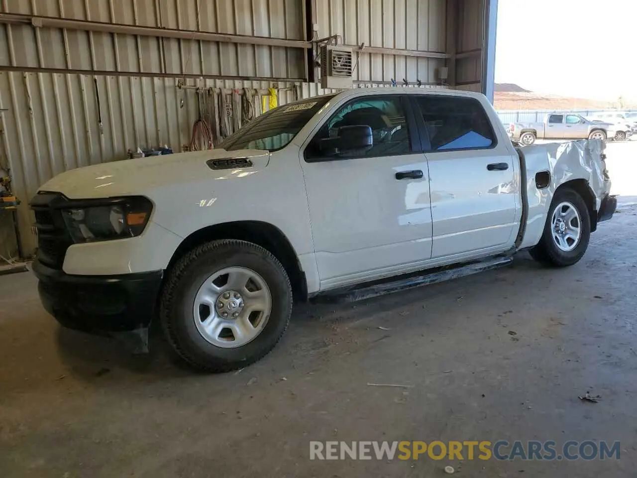 1 Photograph of a damaged car 1C6SRFGT4PN560612 RAM 1500 2023