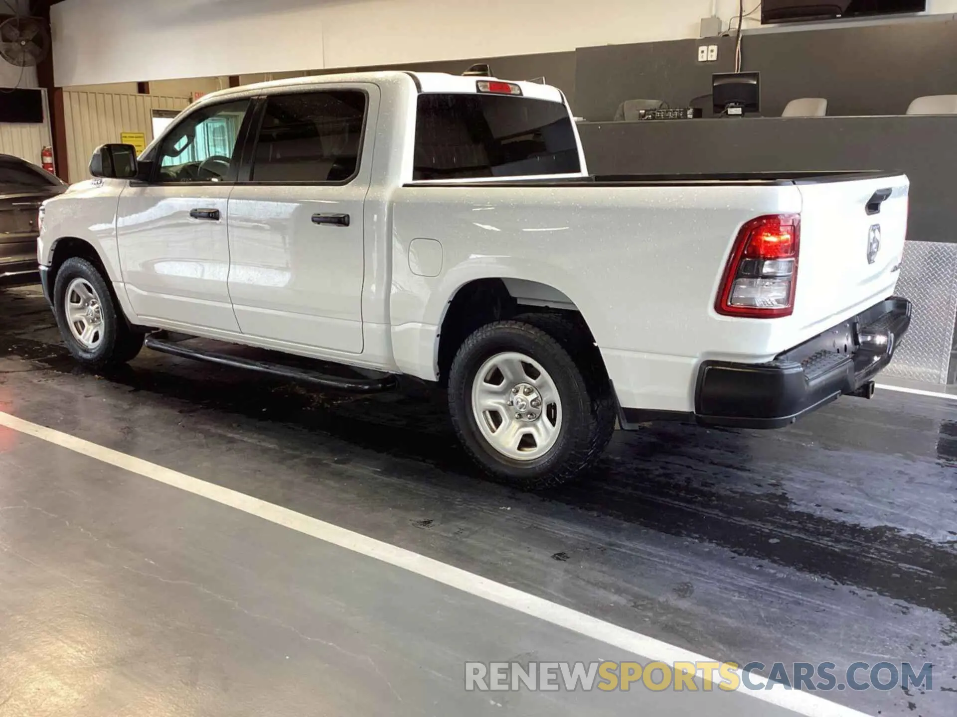 13 Photograph of a damaged car 1C6SRFGT4PN560948 RAM 1500 2023