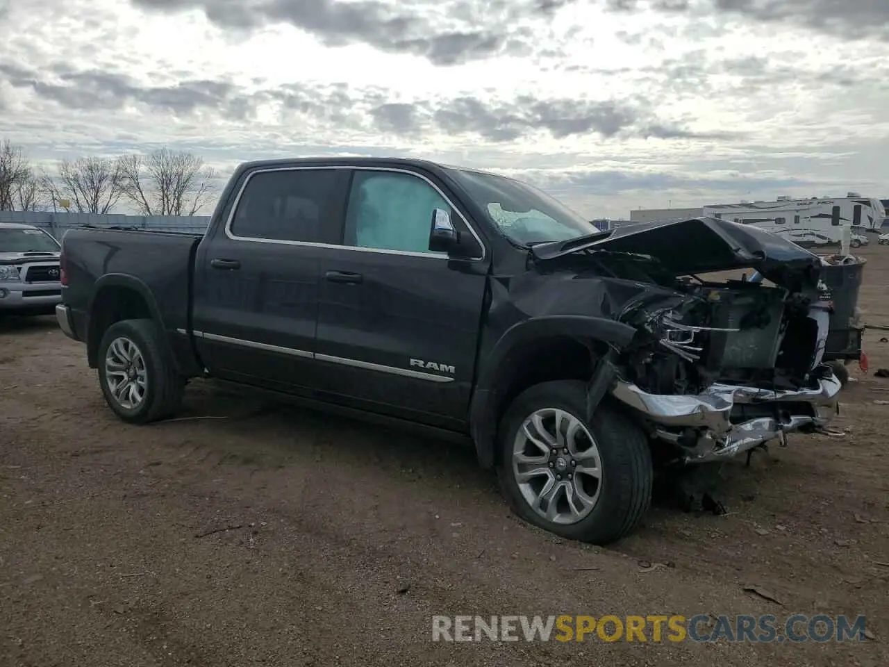 4 Photograph of a damaged car 1C6SRFHT3PN610799 RAM 1500 2023