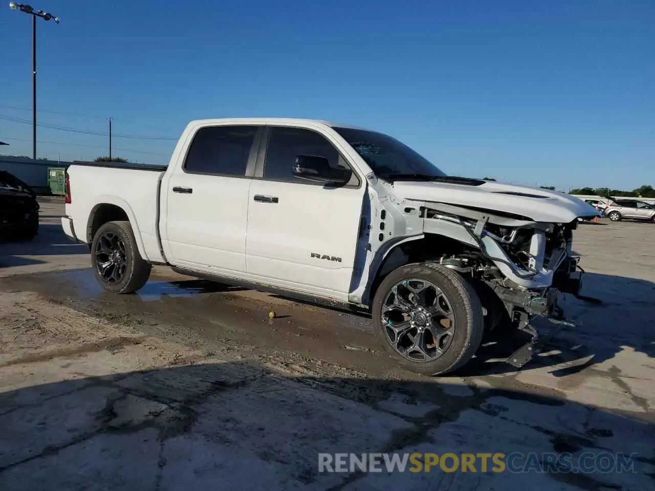 4 Photograph of a damaged car 1C6SRFHT7PN671931 RAM 1500 2023