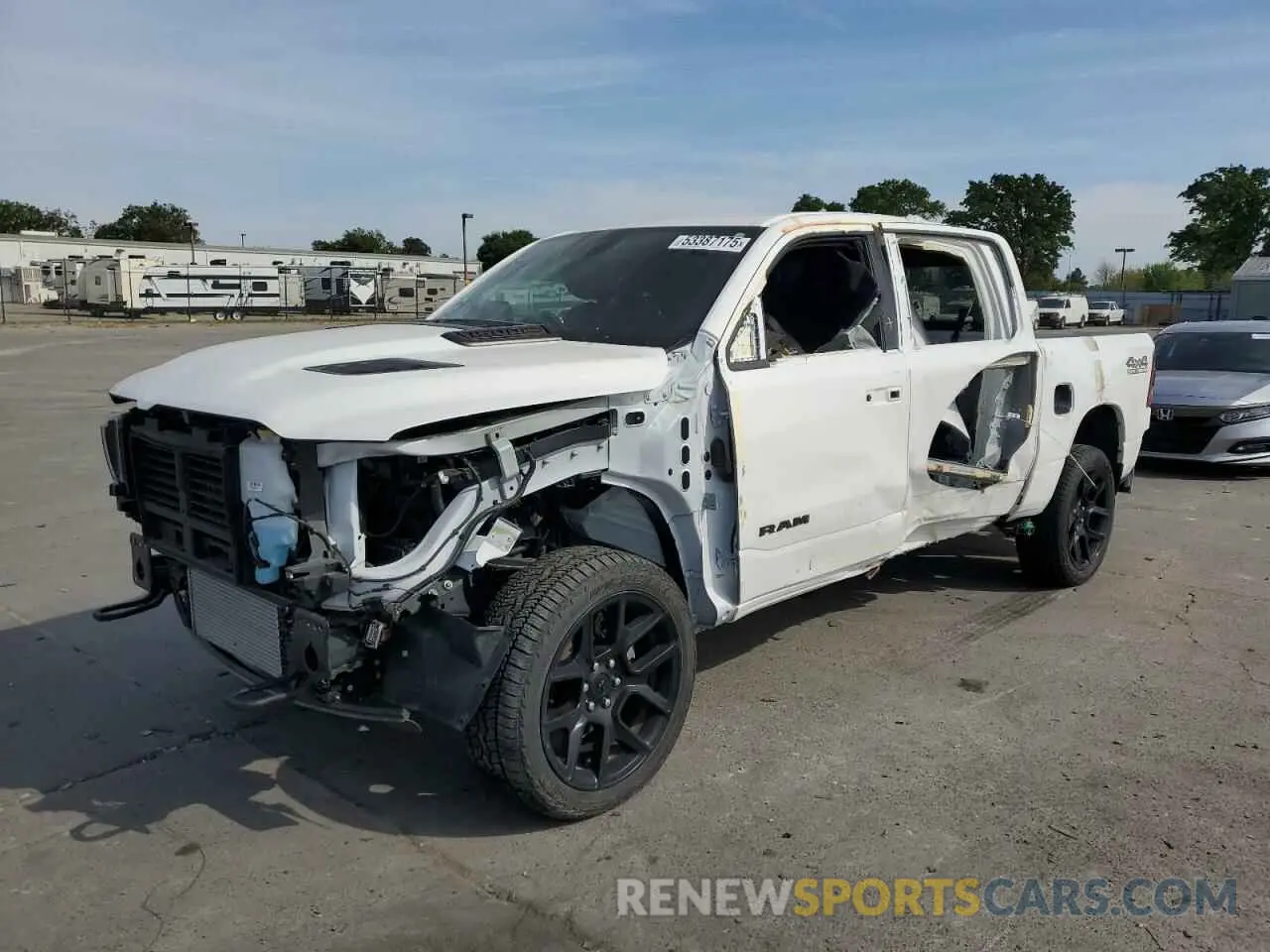 1 Photograph of a damaged car 1C6SRFJM9PN556833 RAM 1500 2023