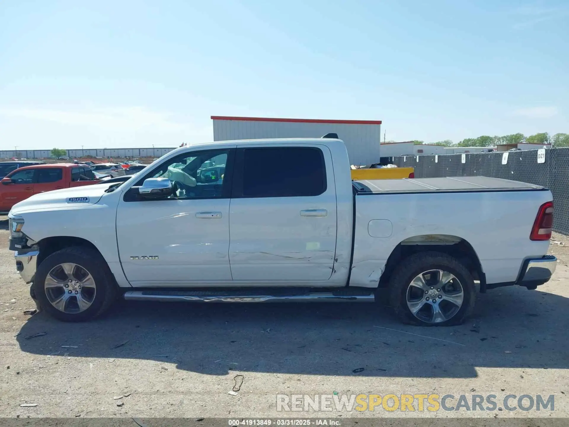 14 Photograph of a damaged car 1C6SRFJT0PN508550 RAM 1500 2023