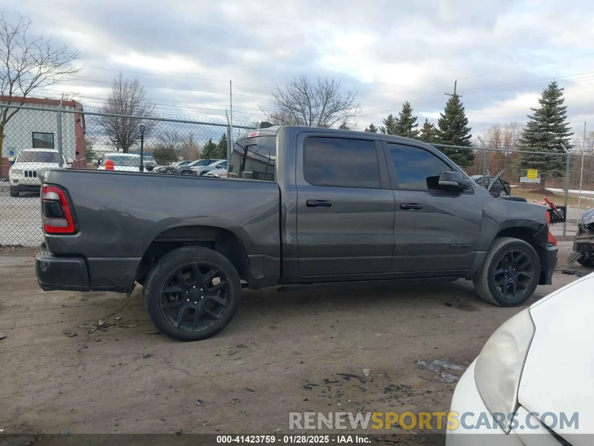 13 Photograph of a damaged car 1C6SRFJT3PN573439 RAM 1500 2023