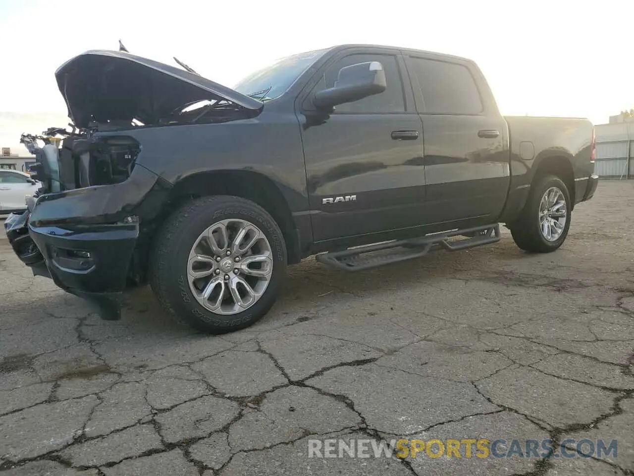1 Photograph of a damaged car 1C6SRFJT3PN662847 RAM 1500 2023