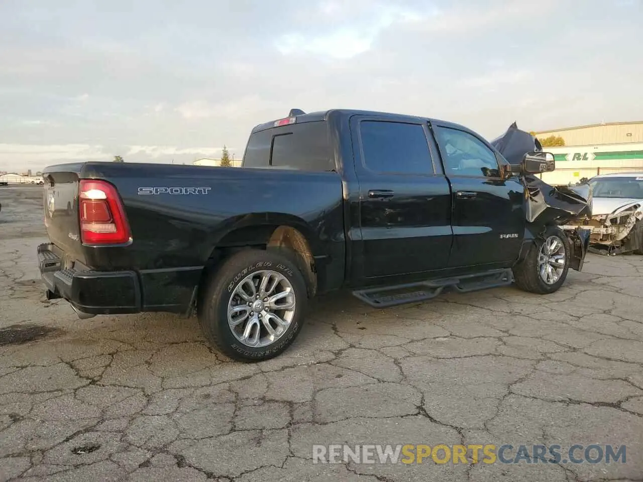 3 Photograph of a damaged car 1C6SRFJT3PN662847 RAM 1500 2023