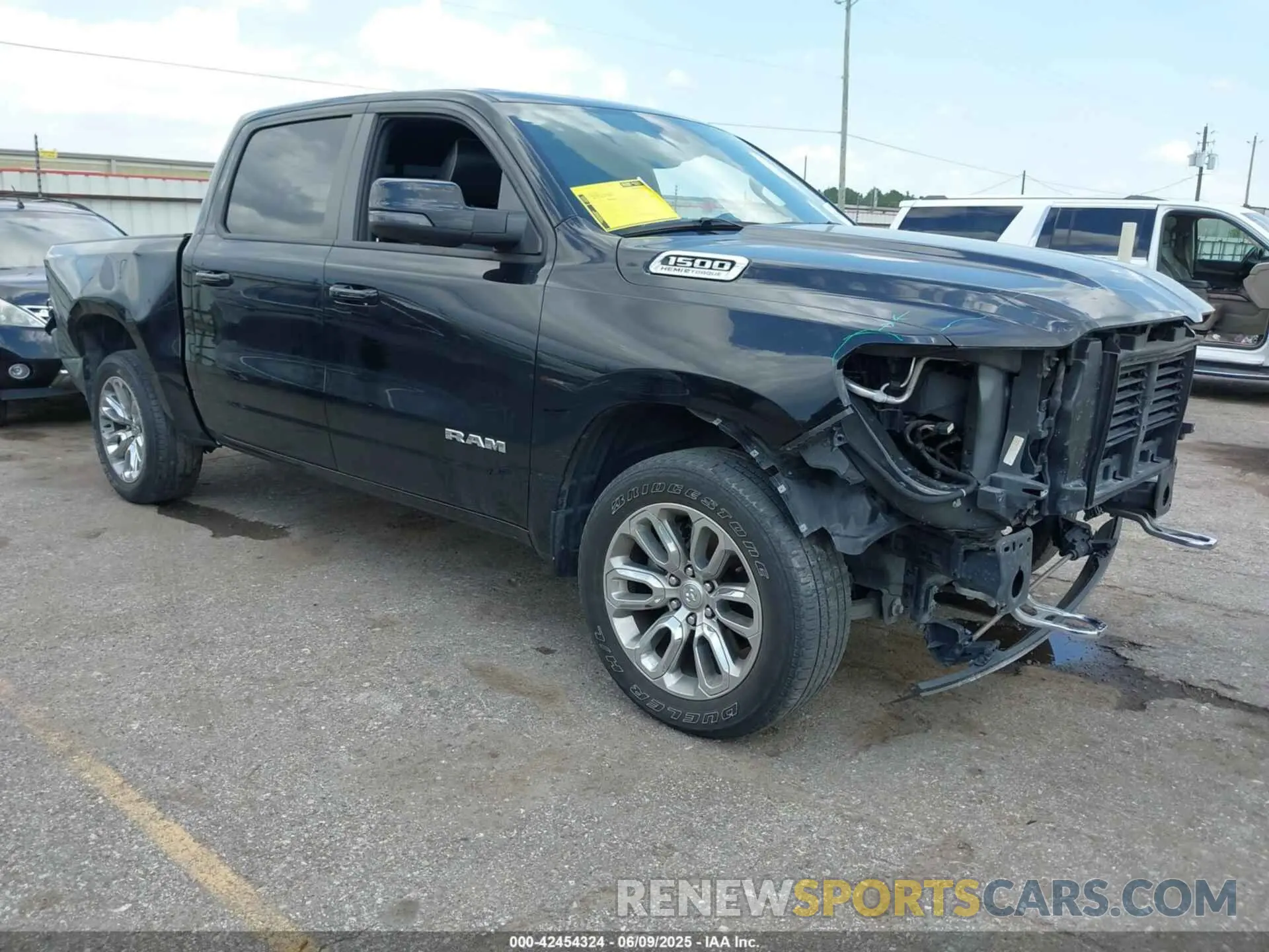 1 Photograph of a damaged car 1C6SRFJT4PN519499 RAM 1500 2023