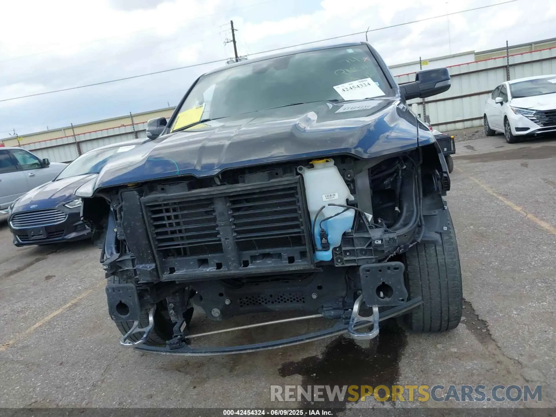 13 Photograph of a damaged car 1C6SRFJT4PN519499 RAM 1500 2023