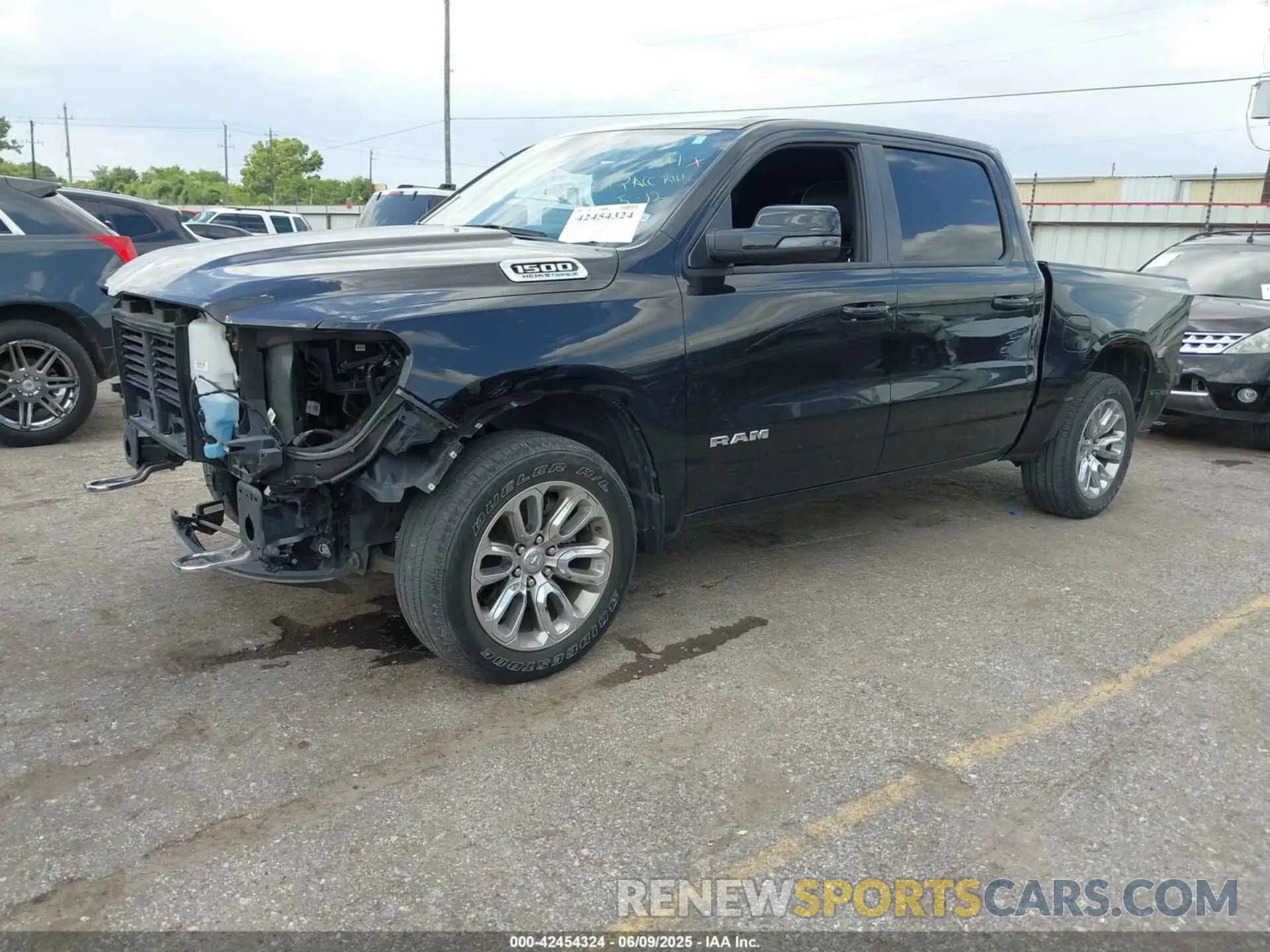2 Photograph of a damaged car 1C6SRFJT4PN519499 RAM 1500 2023