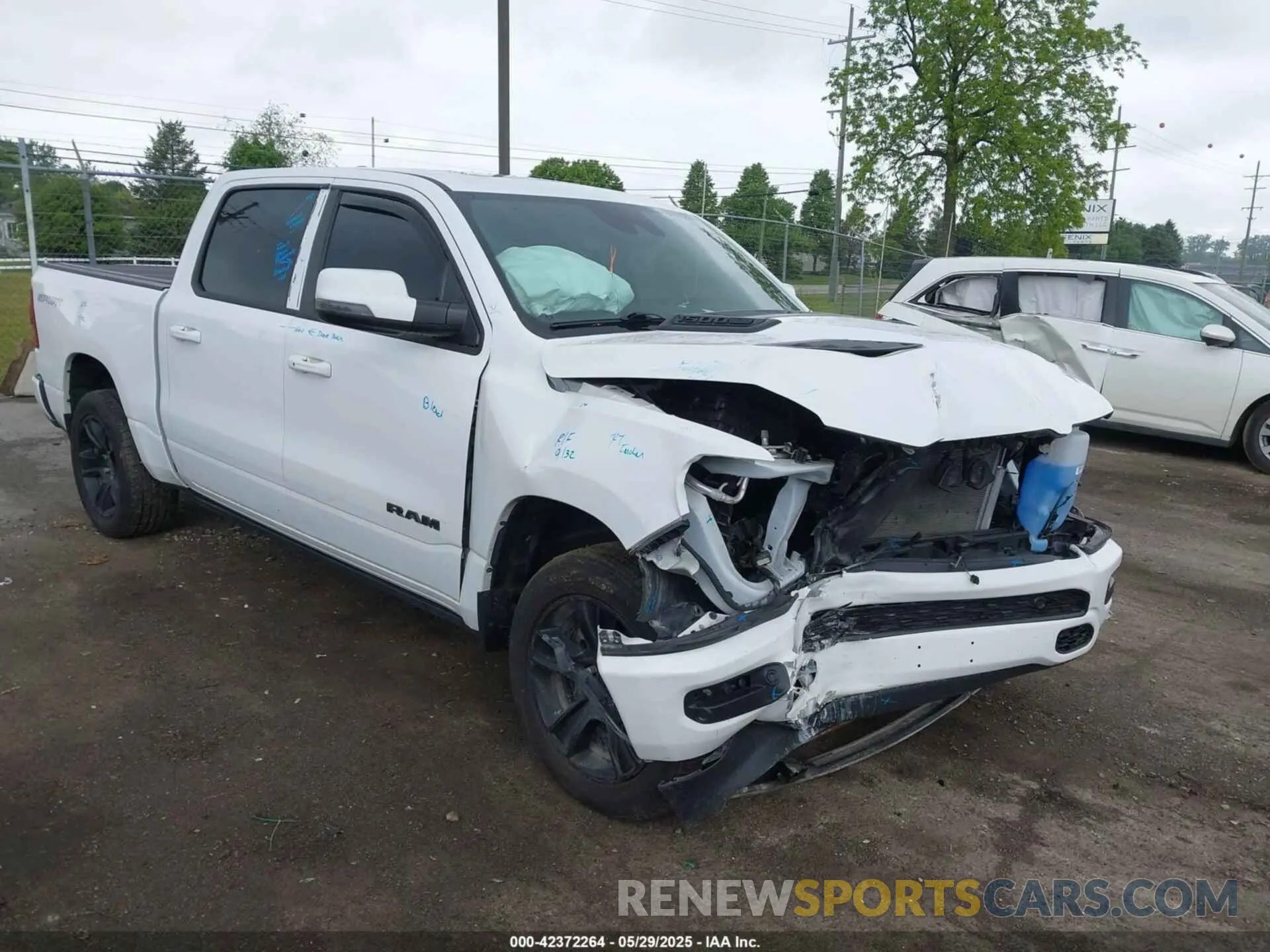 1 Photograph of a damaged car 1C6SRFJT6PN621466 RAM 1500 2023