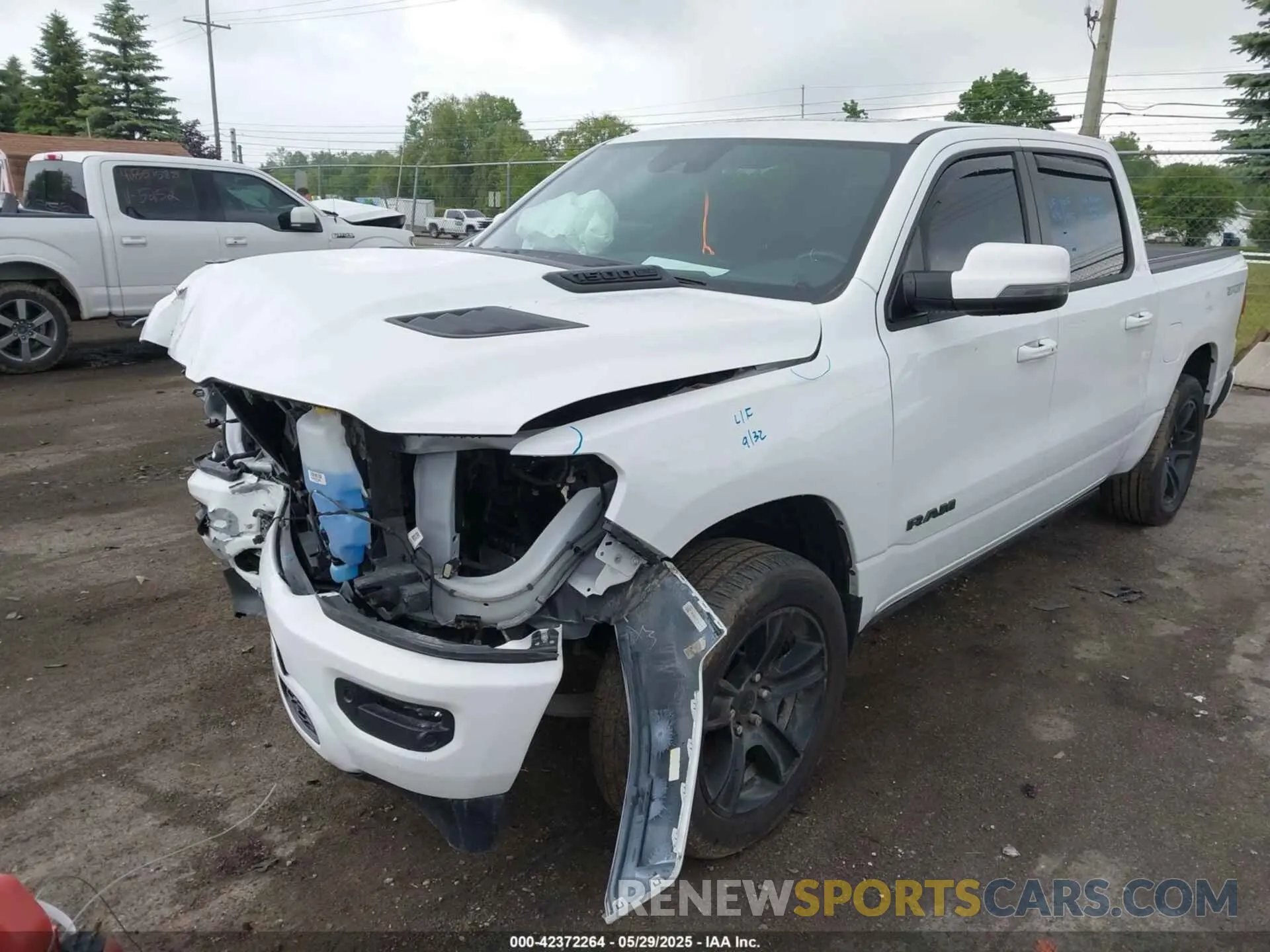 2 Photograph of a damaged car 1C6SRFJT6PN621466 RAM 1500 2023