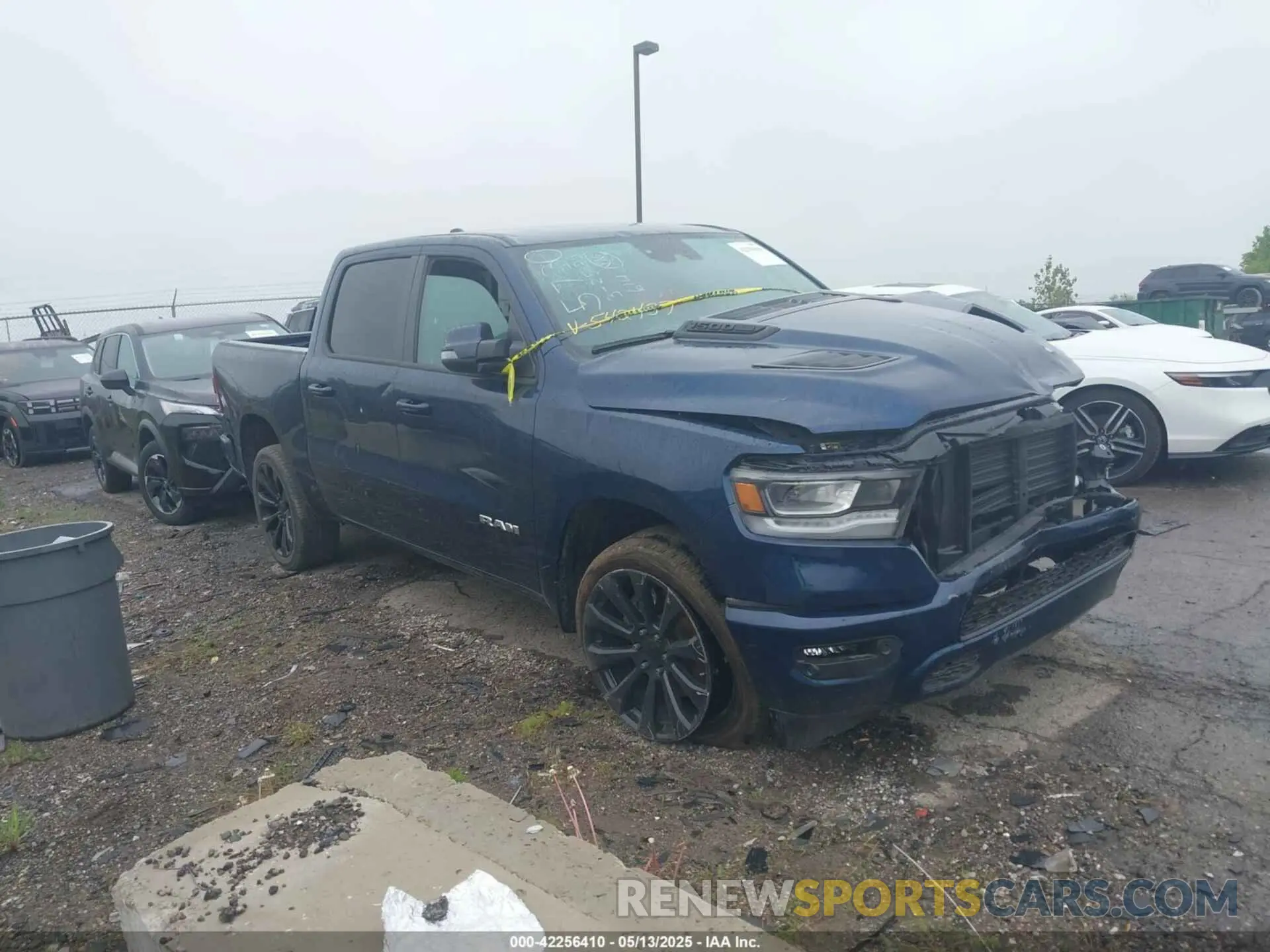 1 Photograph of a damaged car 1C6SRFJT9PN542437 RAM 1500 2023