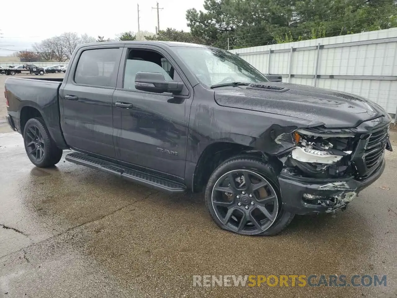 4 Photograph of a damaged car 1C6SRFJTXPN542172 RAM 1500 2023