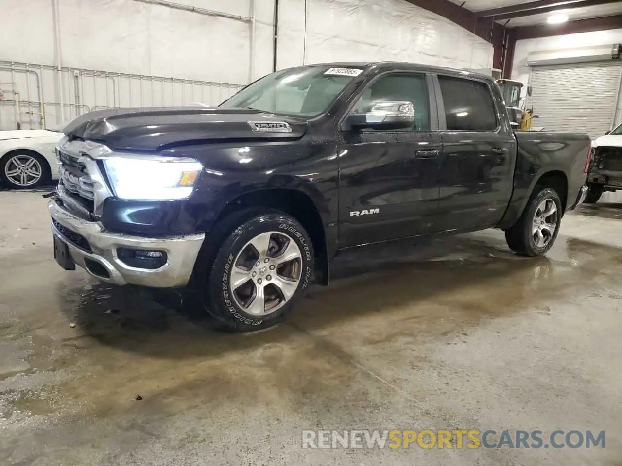 1 Photograph of a damaged car 1C6SRFJTXPN630235 RAM 1500 2023