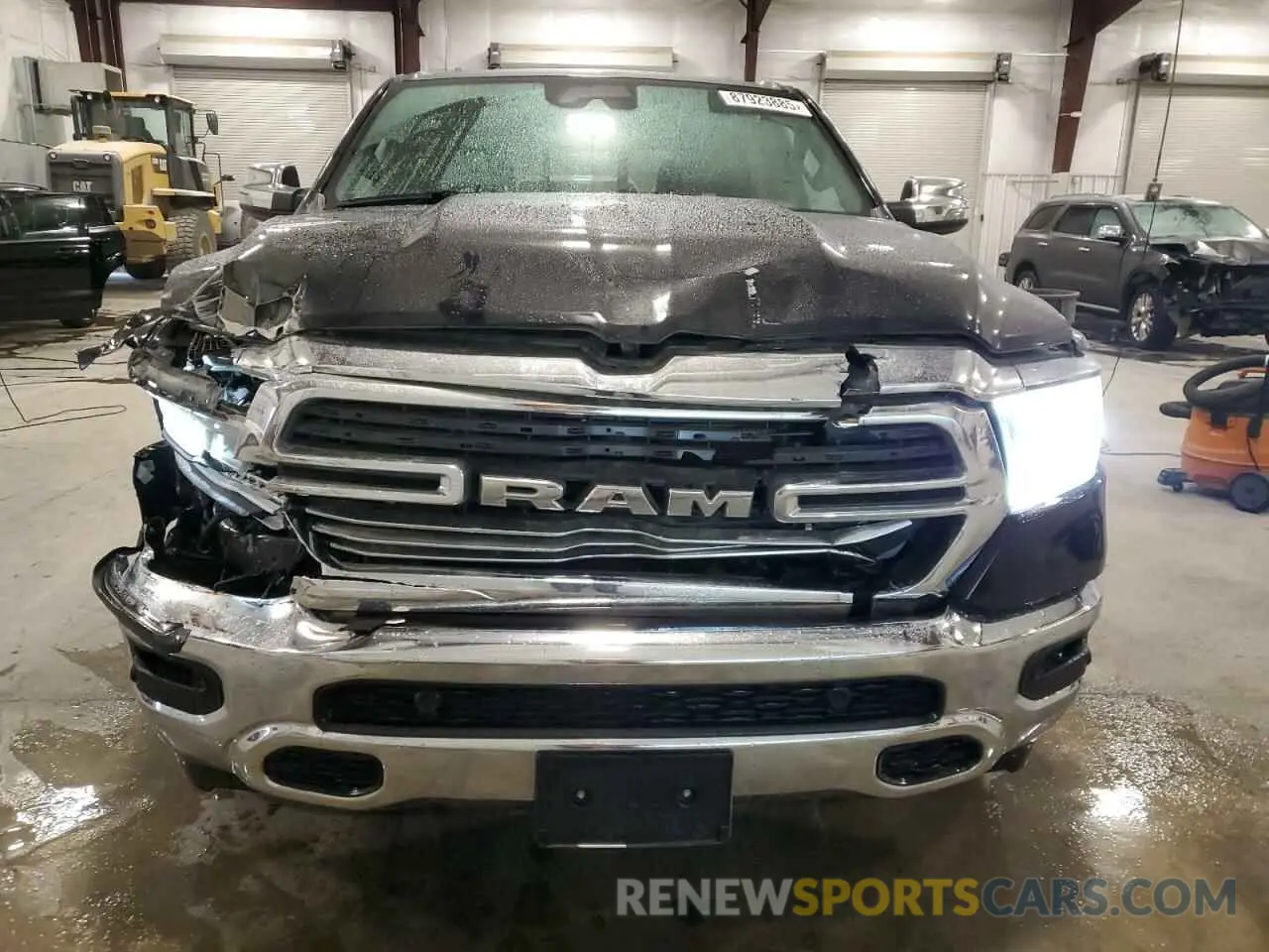 5 Photograph of a damaged car 1C6SRFJTXPN630235 RAM 1500 2023