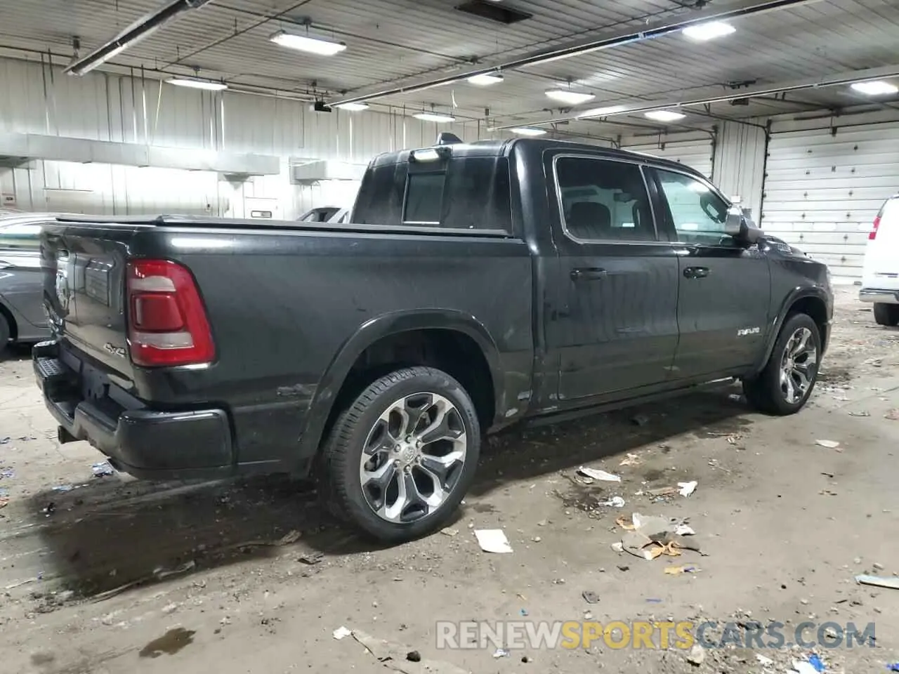 3 Photograph of a damaged car 1C6SRFKT9PN689128 RAM 1500 2023