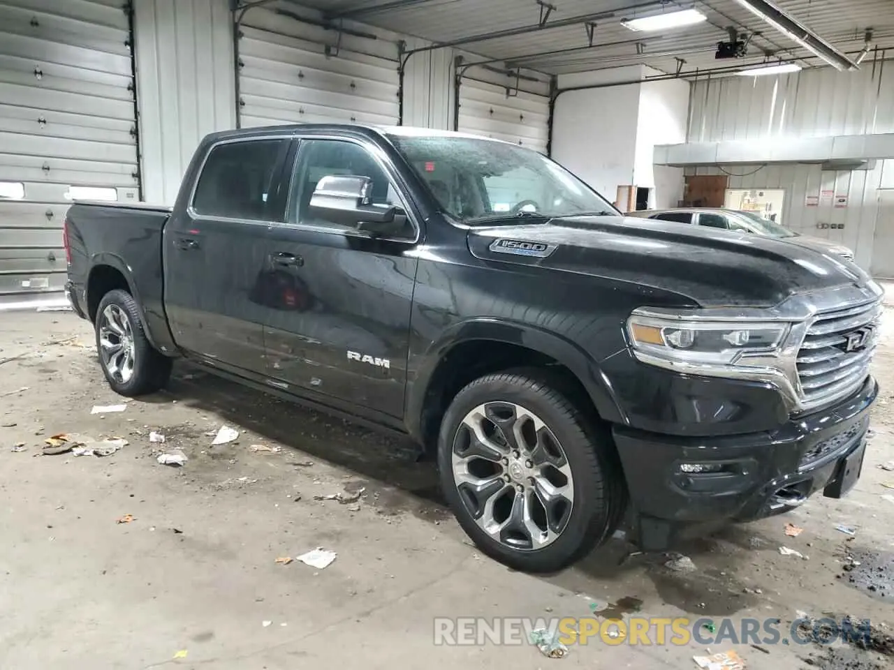 4 Photograph of a damaged car 1C6SRFKT9PN689128 RAM 1500 2023