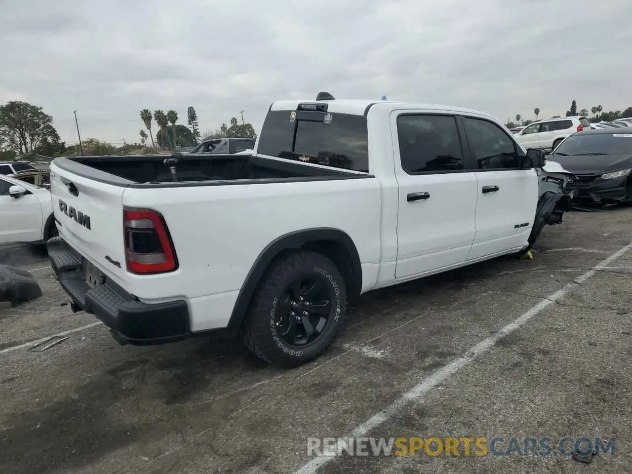 3 Photograph of a damaged car 1C6SRFLT6PN629323 RAM 1500 2023