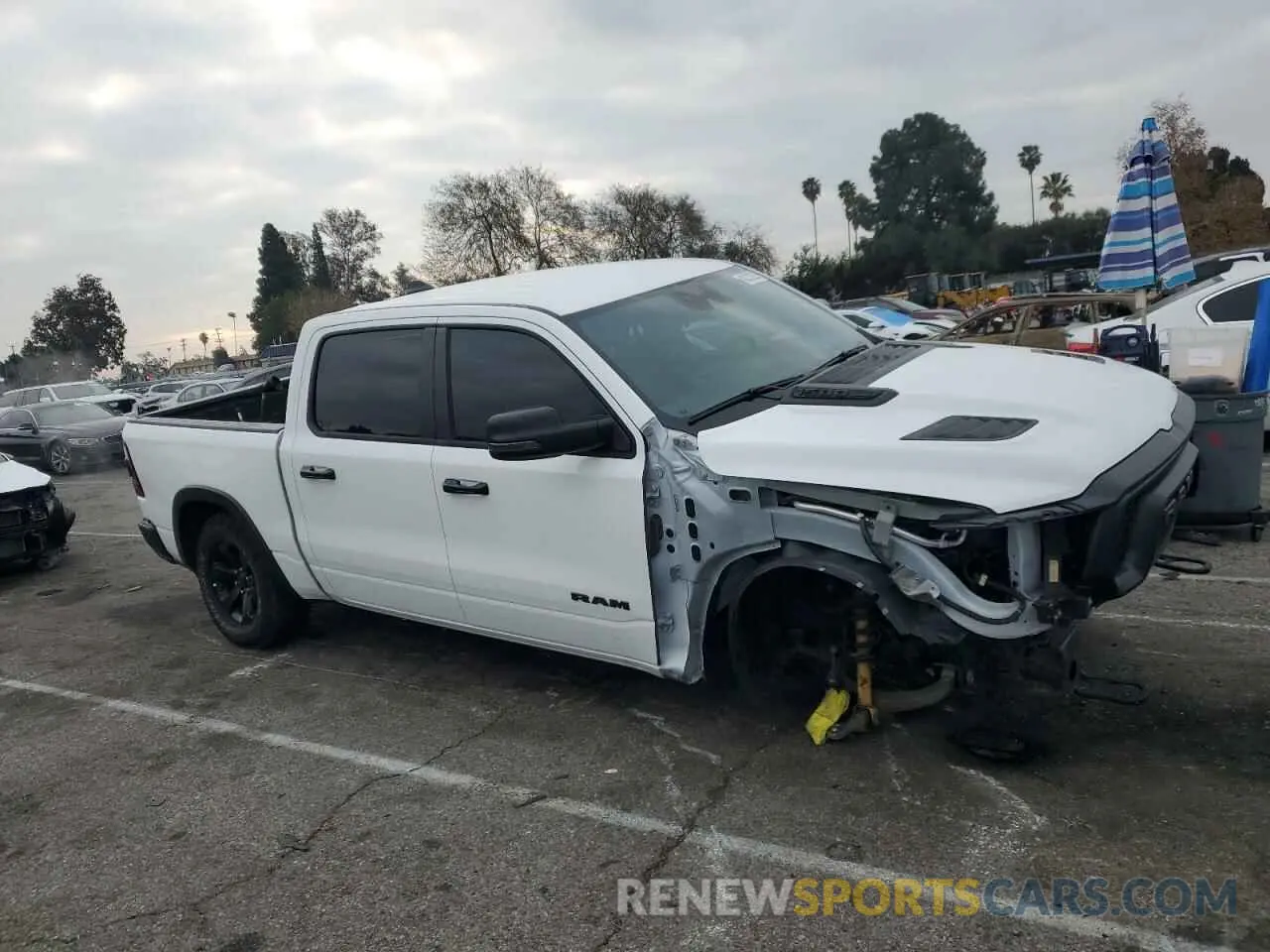 4 Photograph of a damaged car 1C6SRFLT6PN629323 RAM 1500 2023