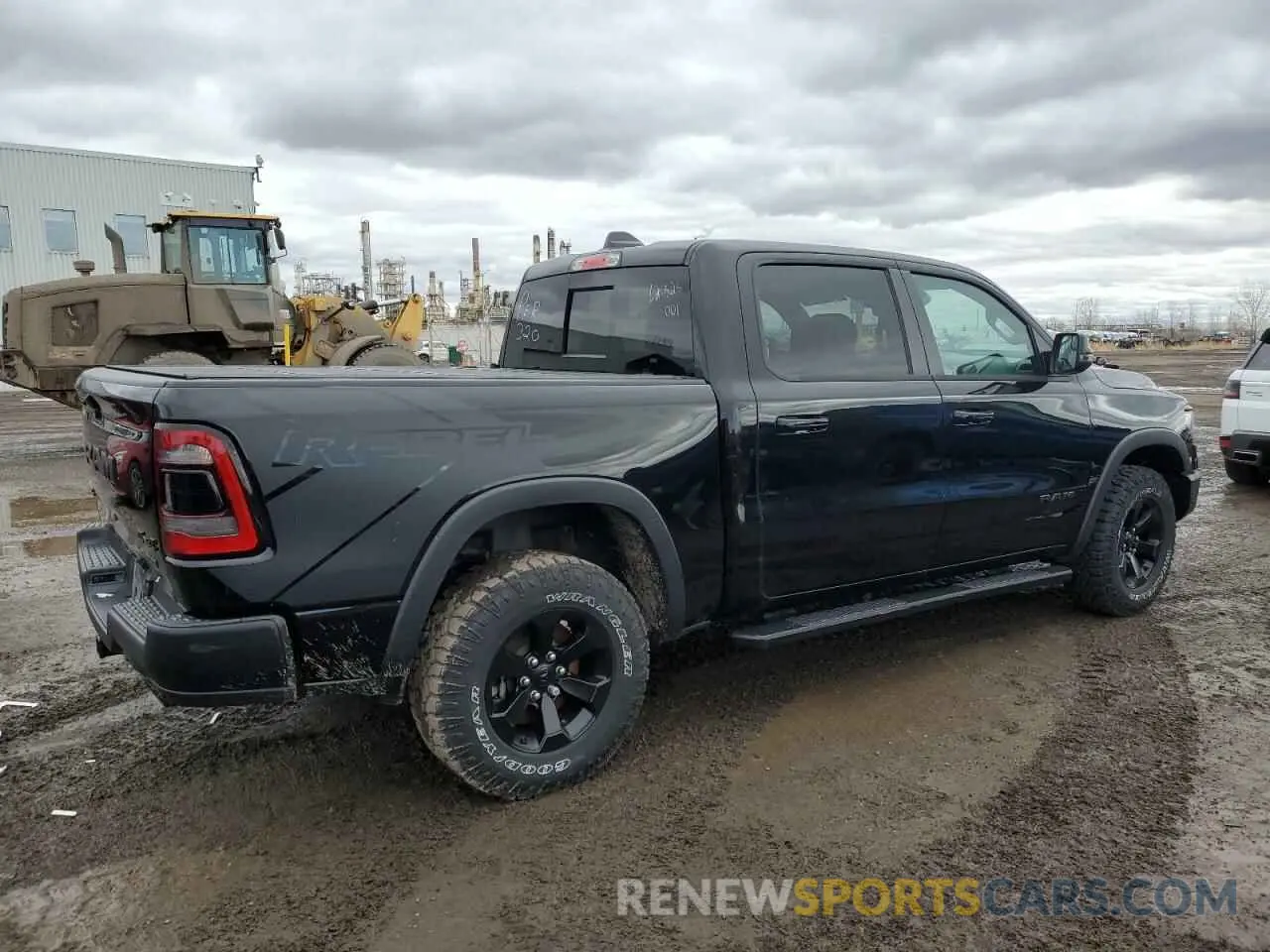 3 Photograph of a damaged car 1C6SRFLT6PN700696 RAM 1500 2023