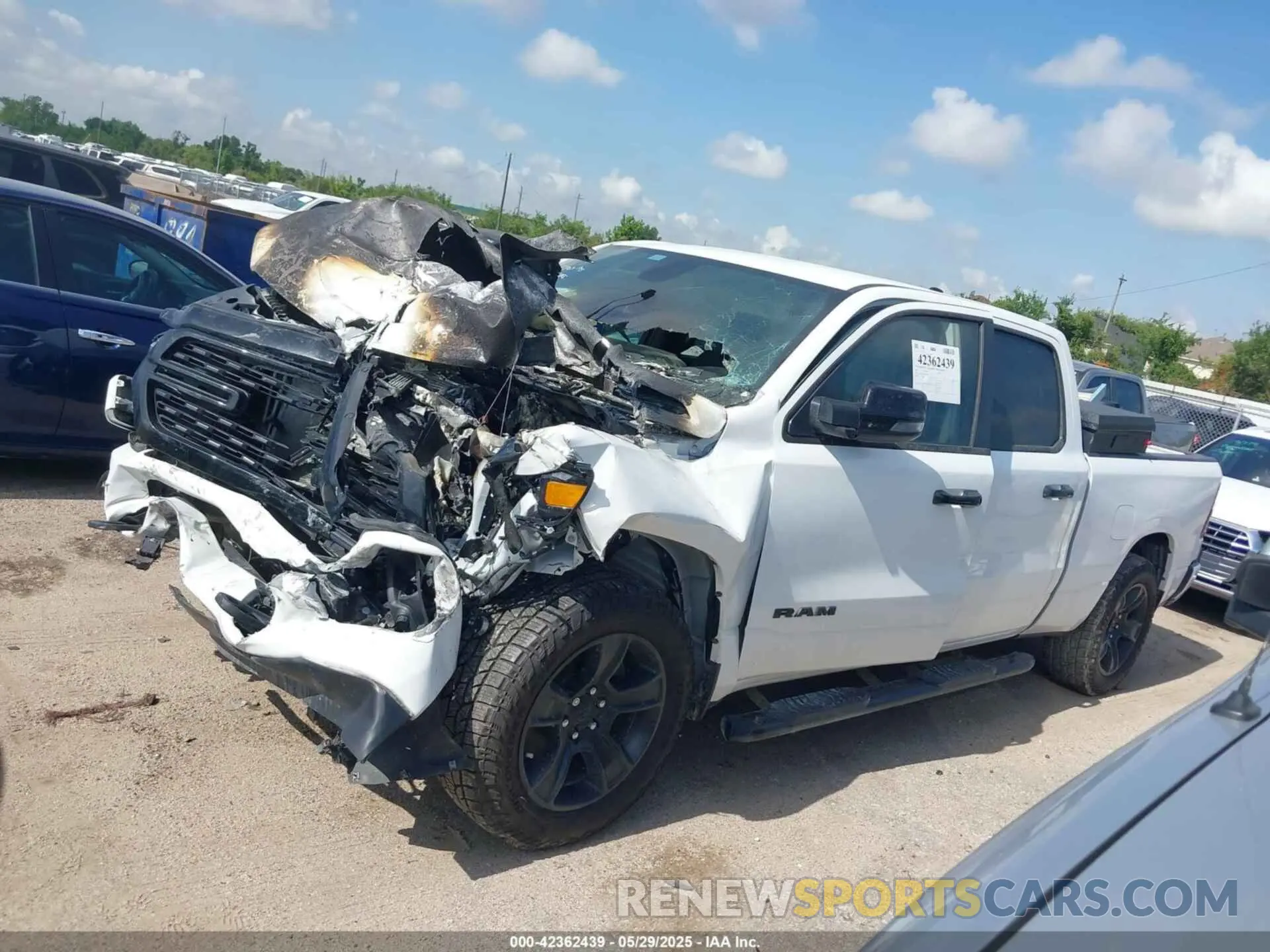 2 Photograph of a damaged car 1C6SRFMT3PN636003 RAM 1500 2023