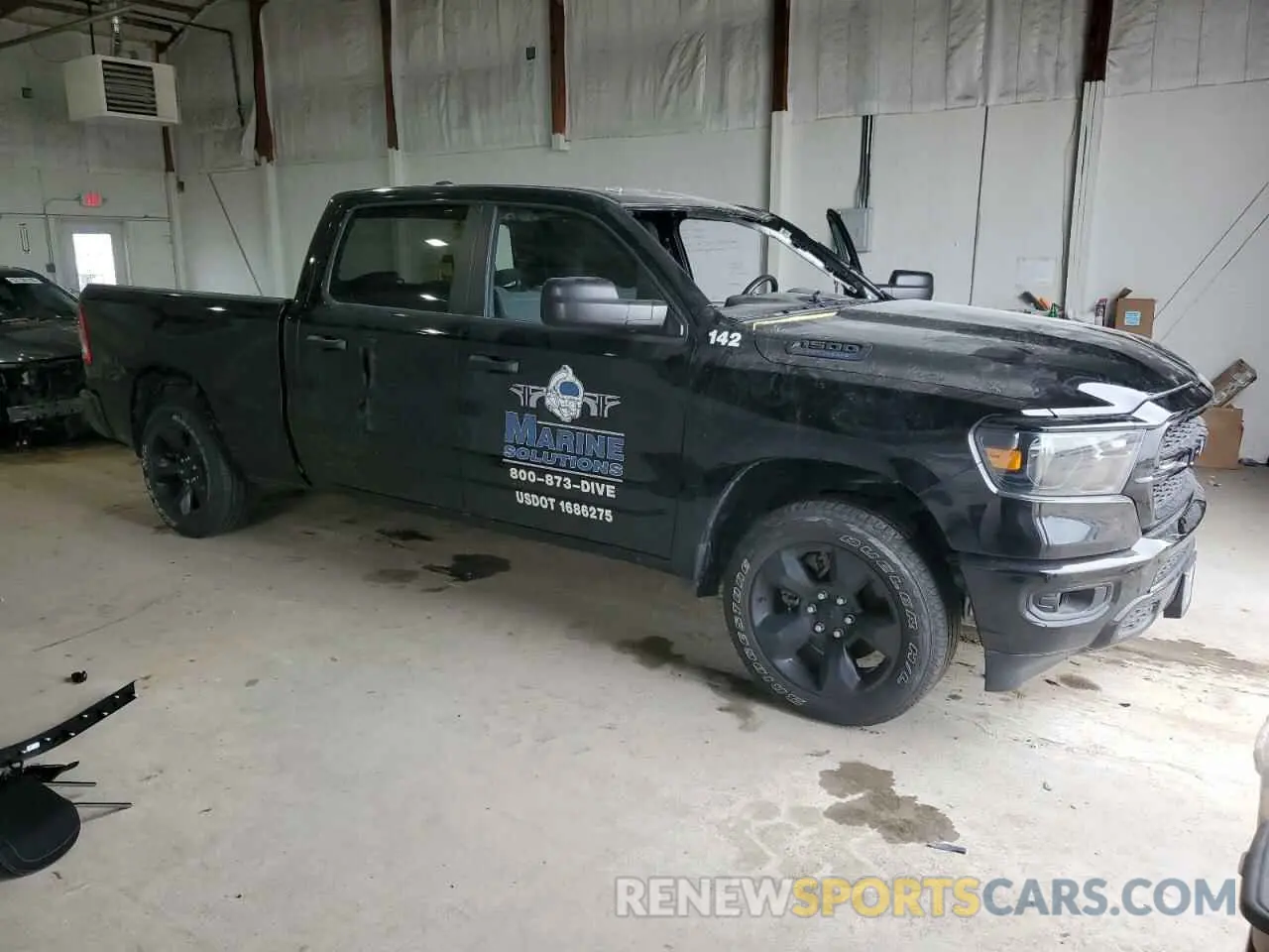 4 Photograph of a damaged car 1C6SRFNT3PN687144 RAM 1500 2023