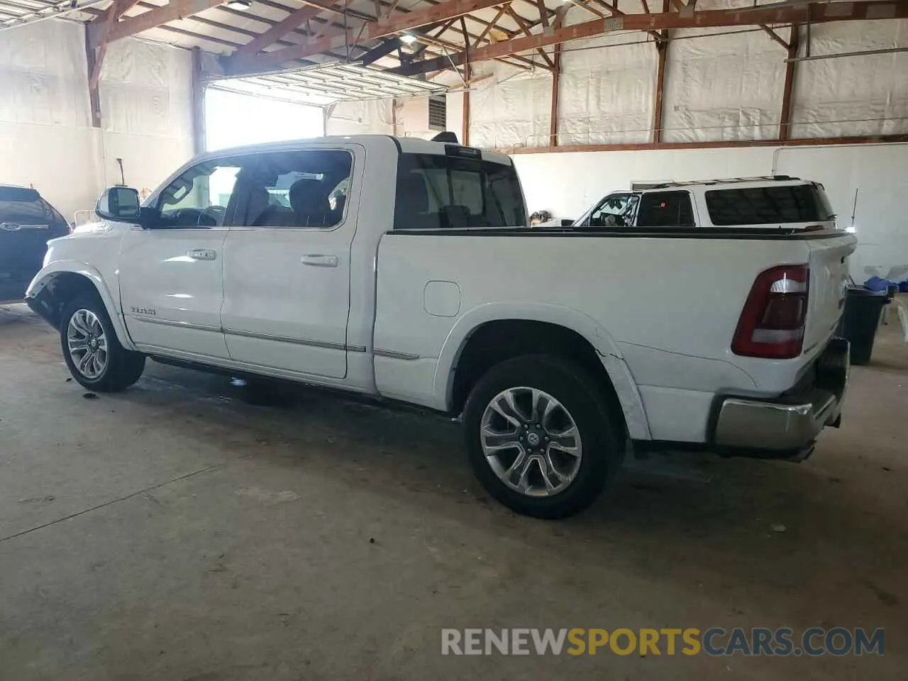 2 Photograph of a damaged car 1C6SRFPT8PN586582 RAM 1500 2023