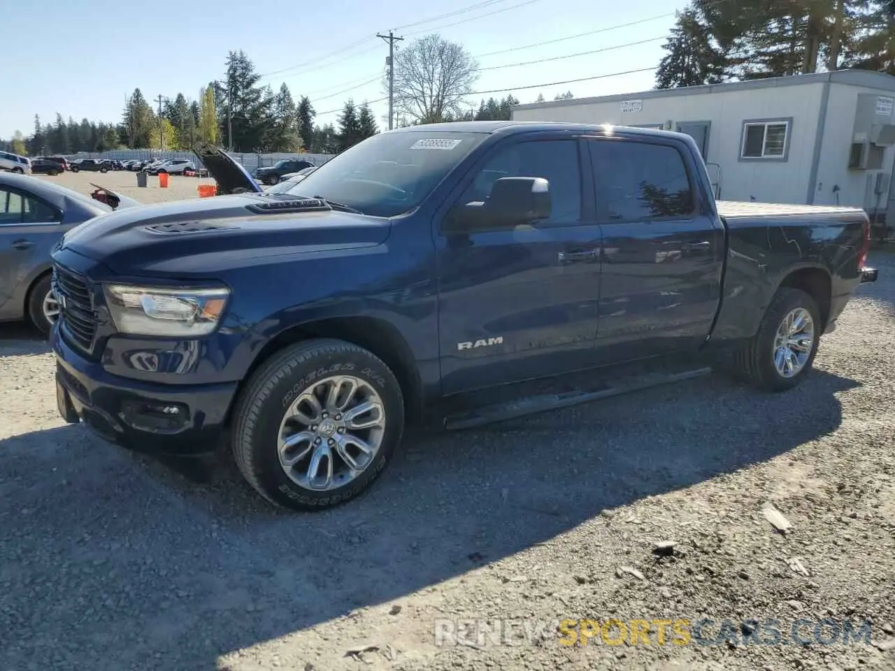 1 Photograph of a damaged car 1C6SRFRT1PN589871 RAM 1500 2023