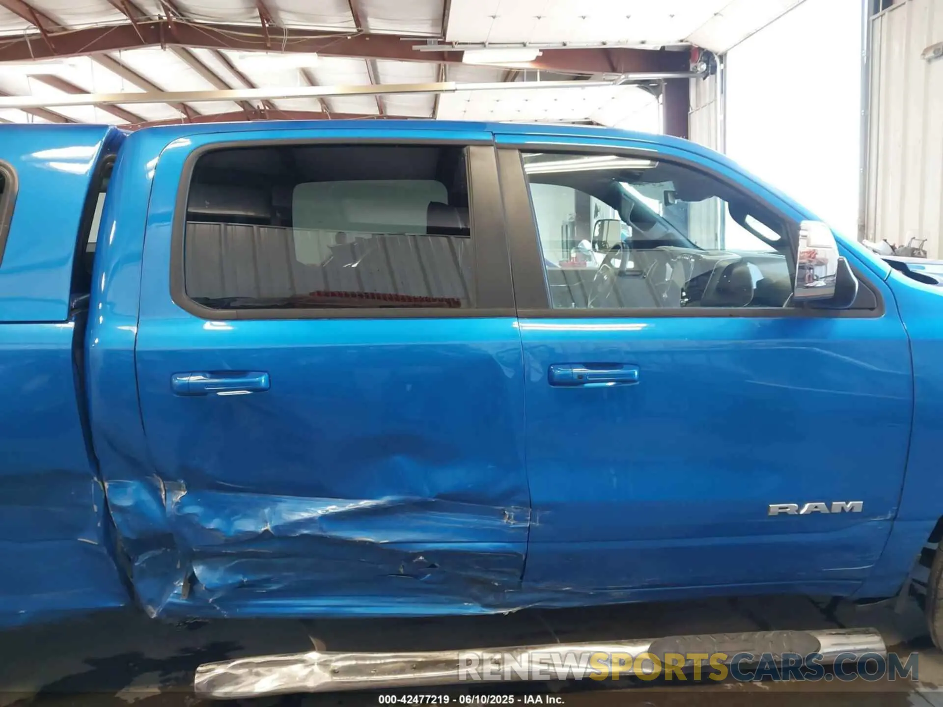 13 Photograph of a damaged car 1C6SRFRT4PN596782 RAM 1500 2023